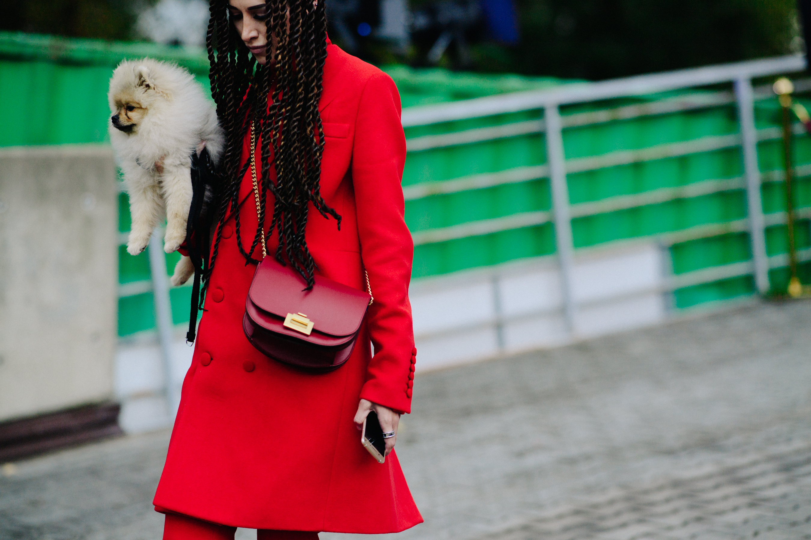 Woman with a puppy wearing all red