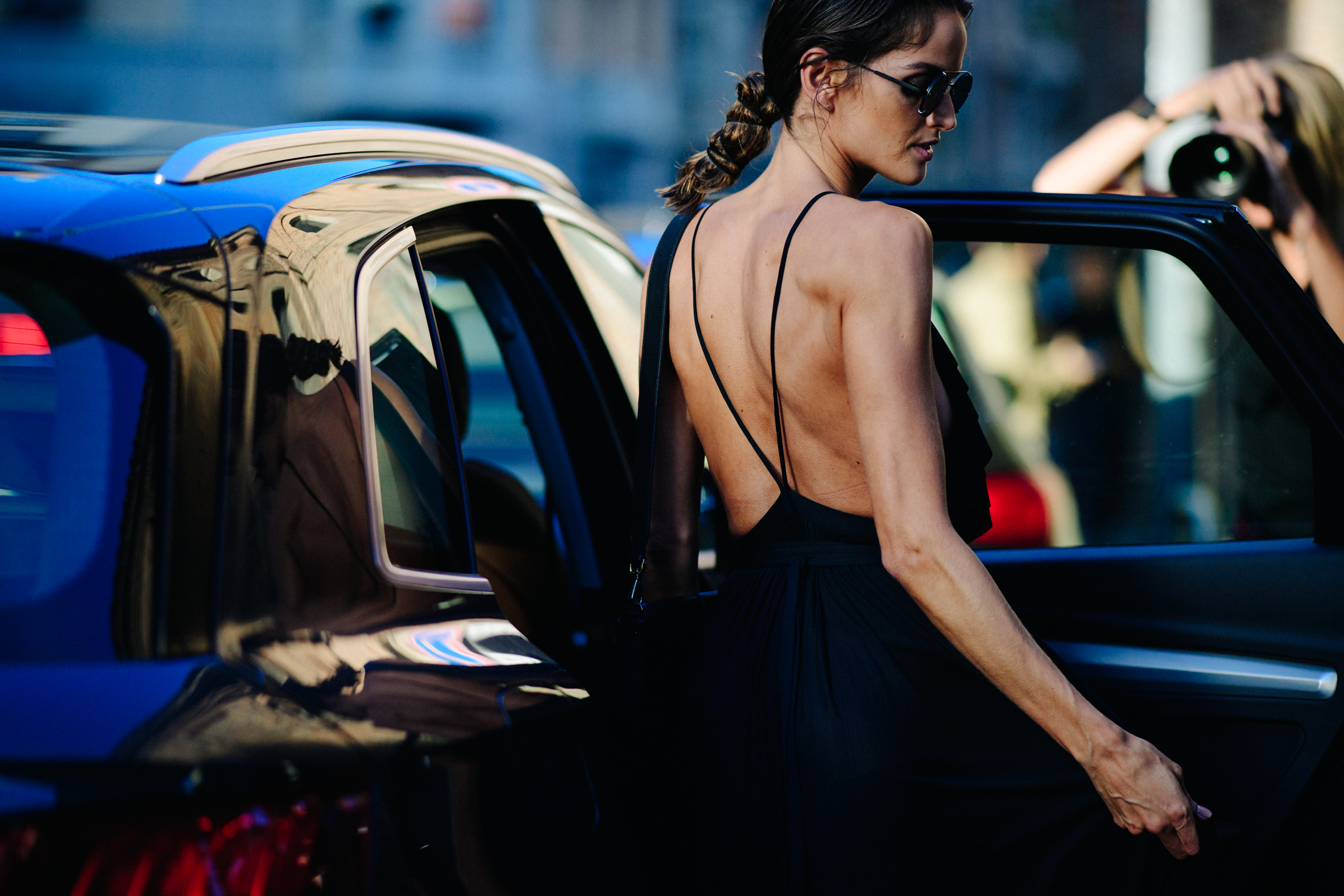Model wearing open back dress