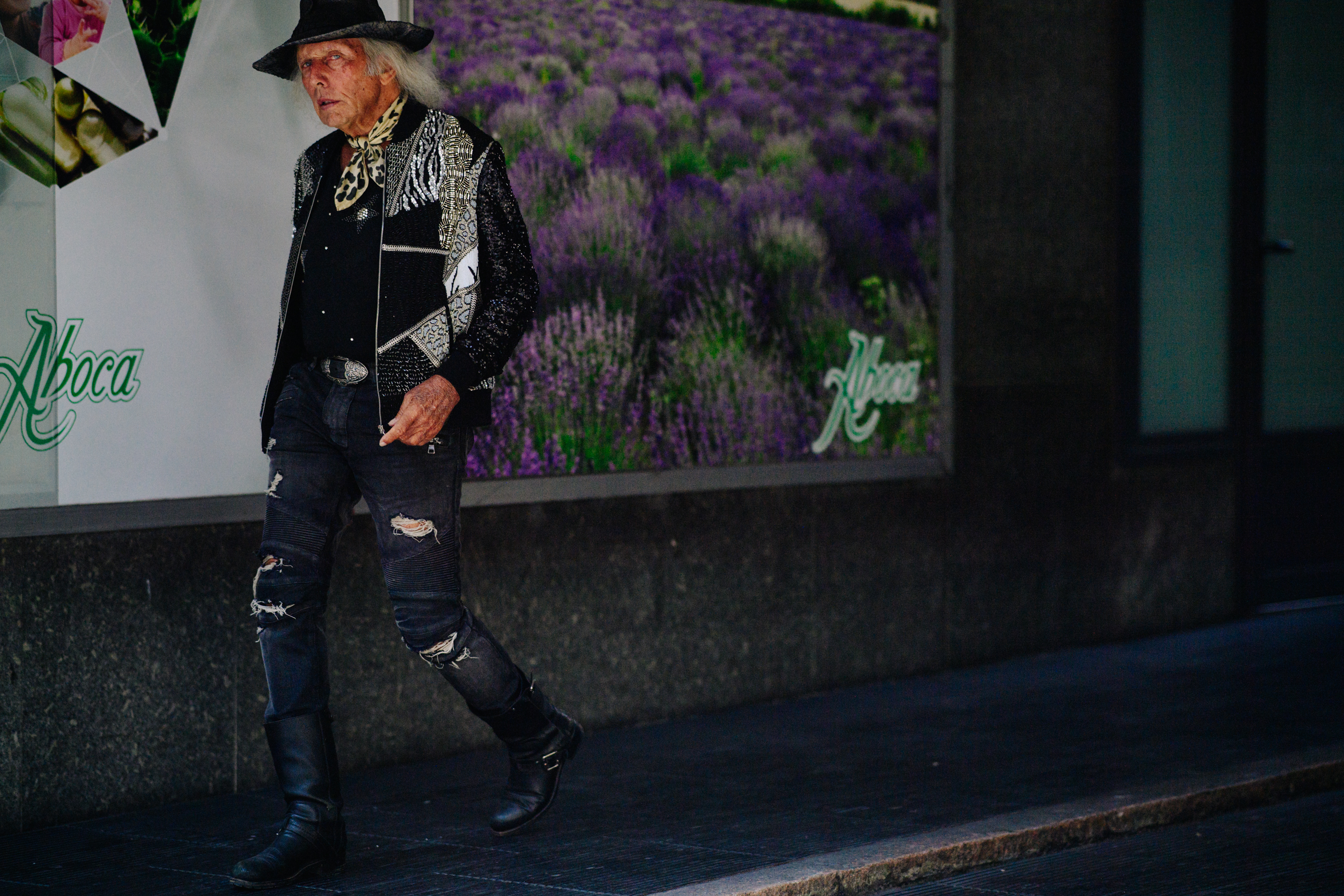 Man wearing black cowboy hat and boots