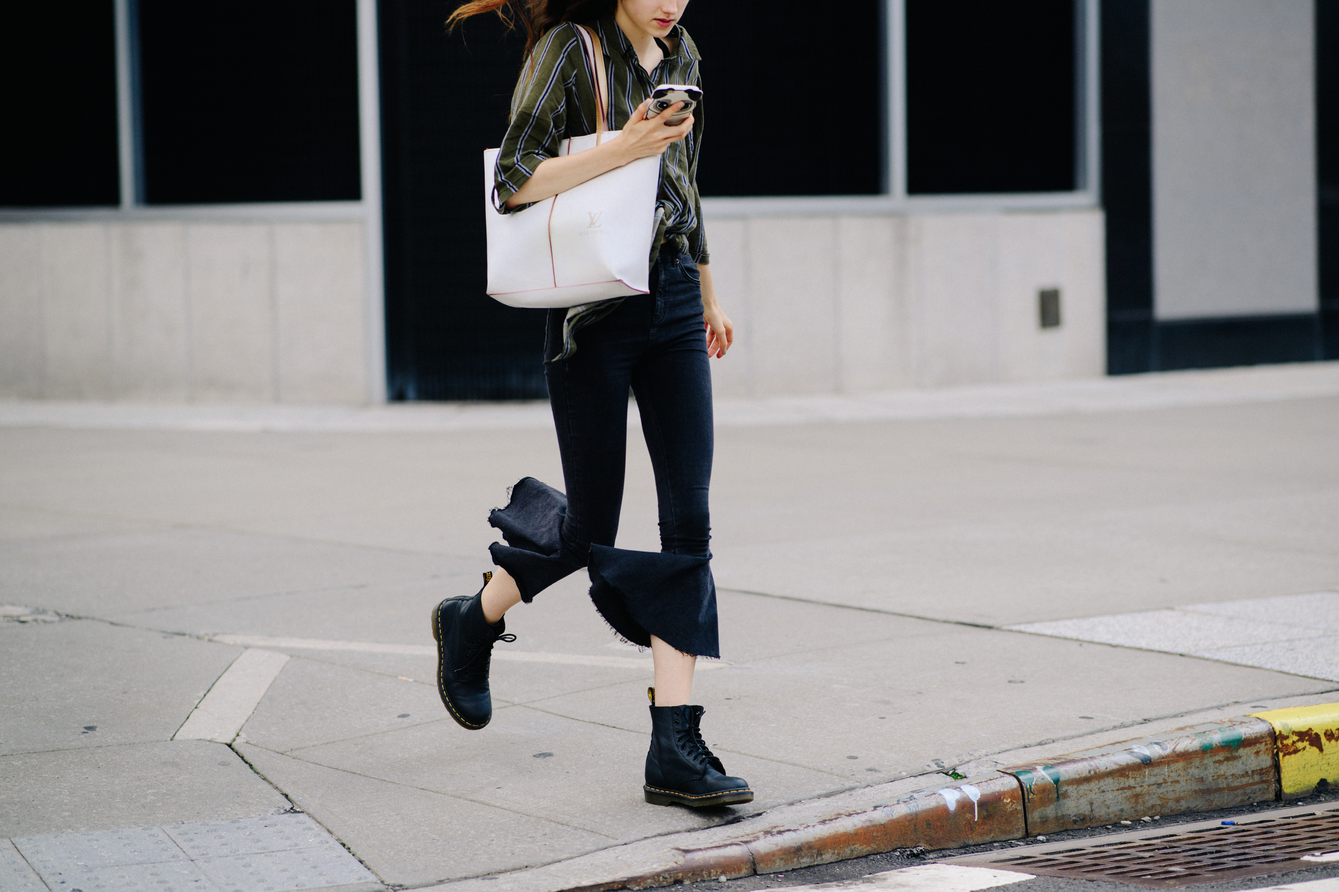 Model wearing black pants after a show