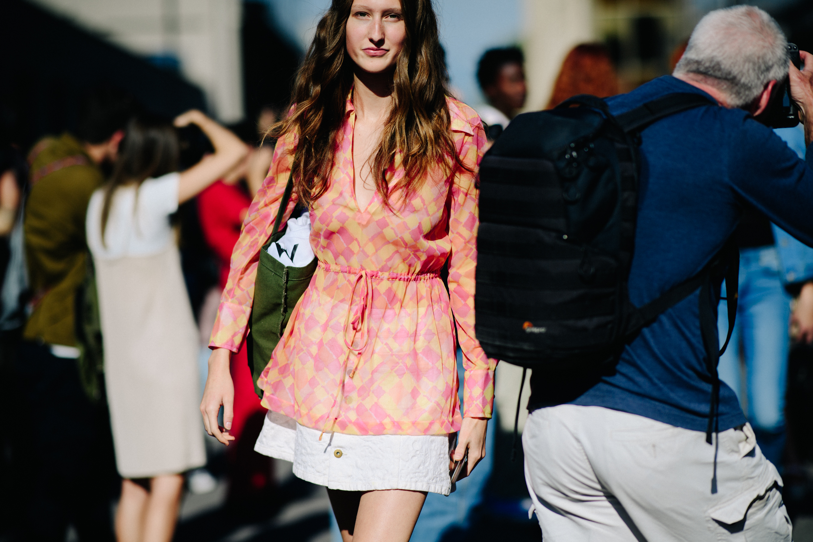 American model in pink check dress