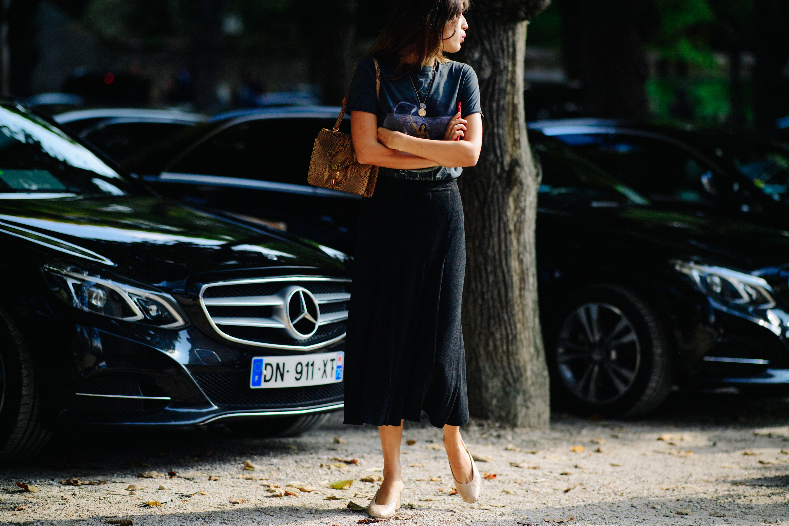 French woman wearing long black pencil skirt