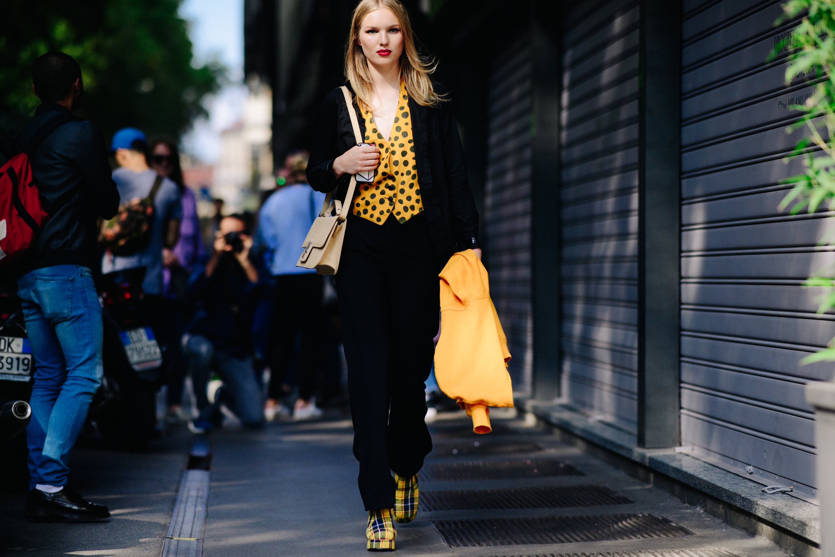 Model wearing yellow shirt and matching boots