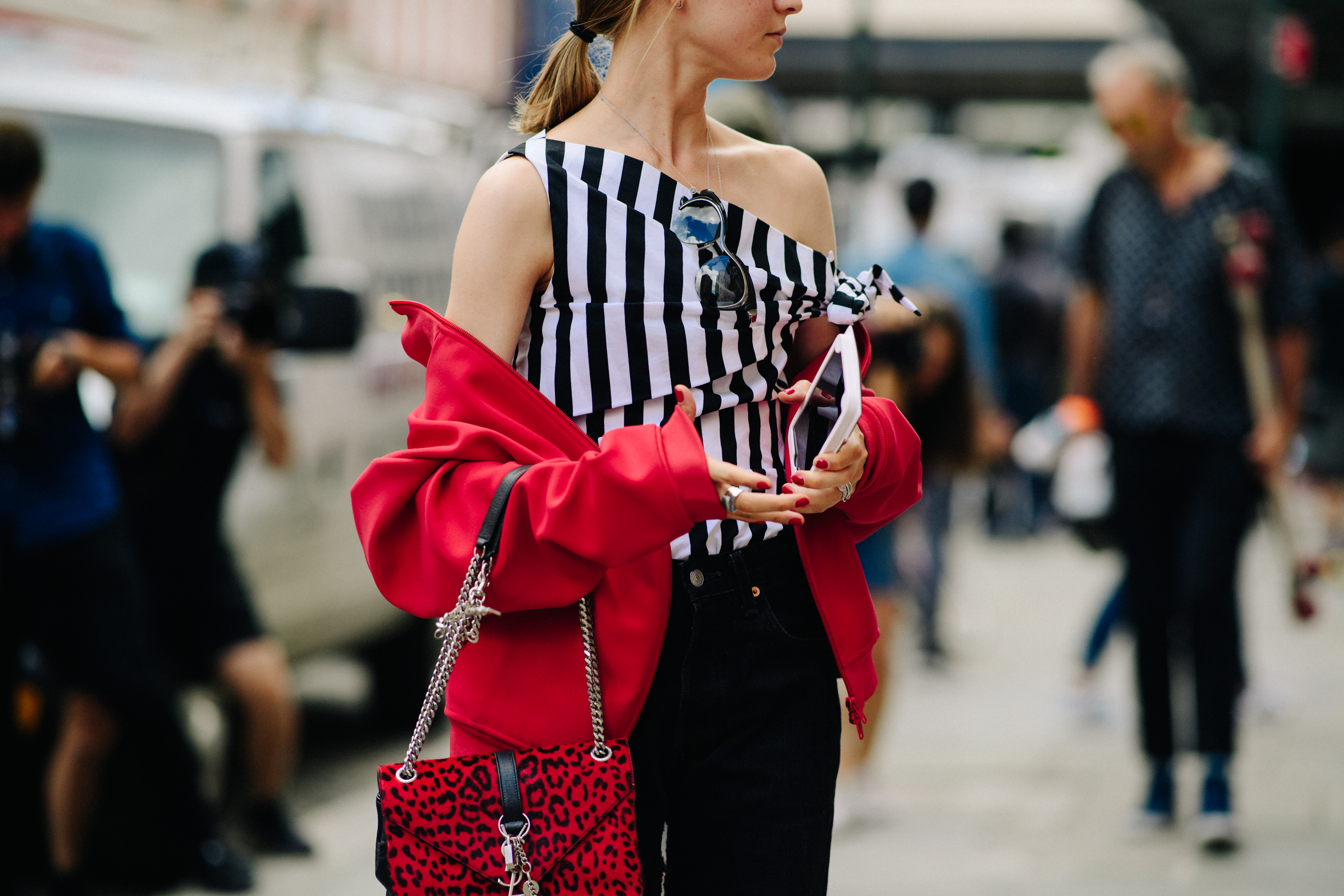 Edito wearing red jacket and bag