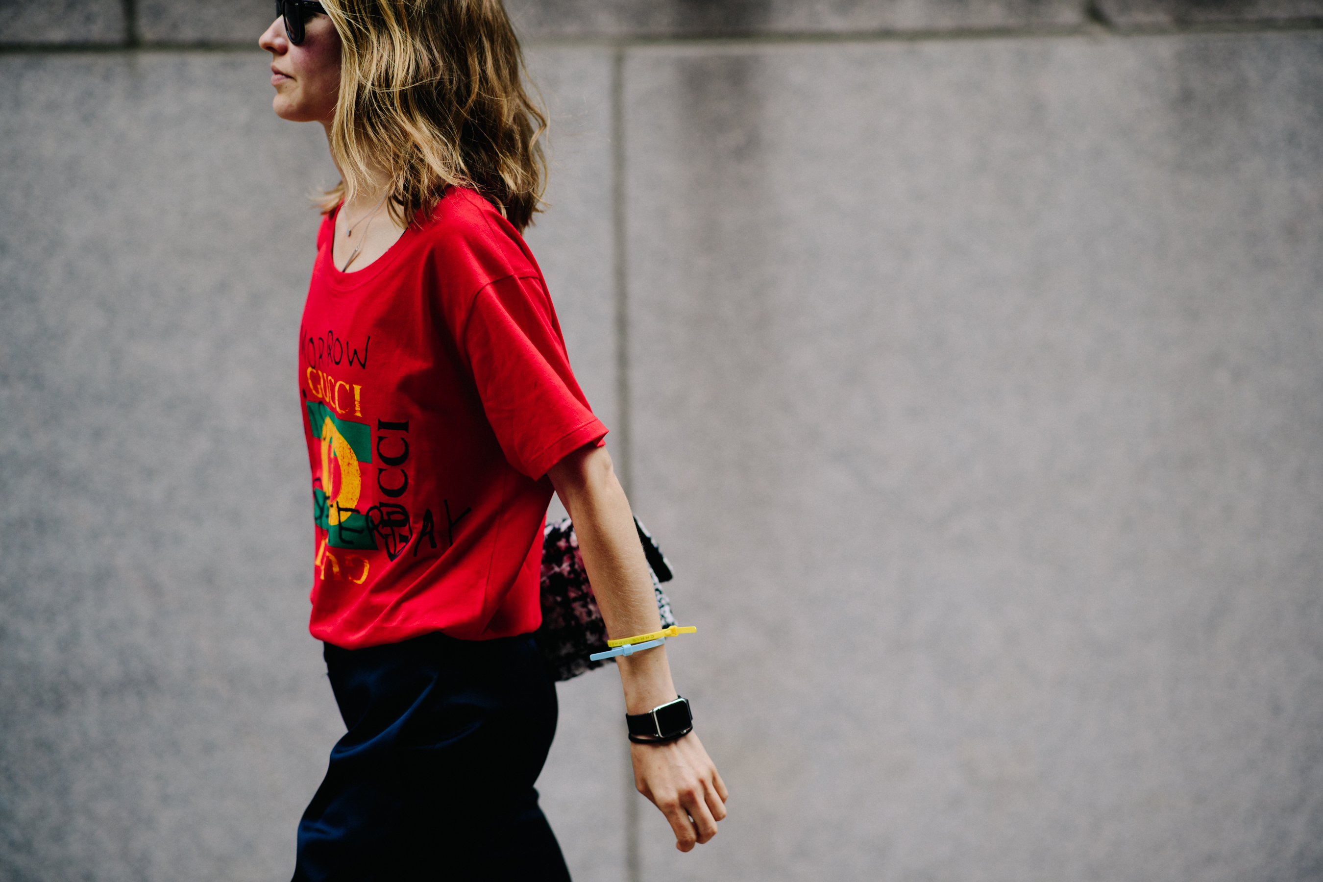 Editor wearing red Gucci t-shirt