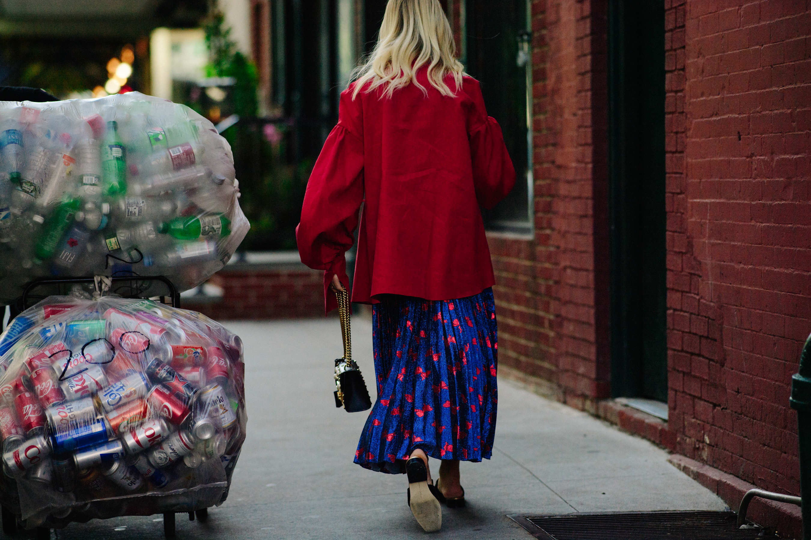 Wman wearing floral skirt and red shirt