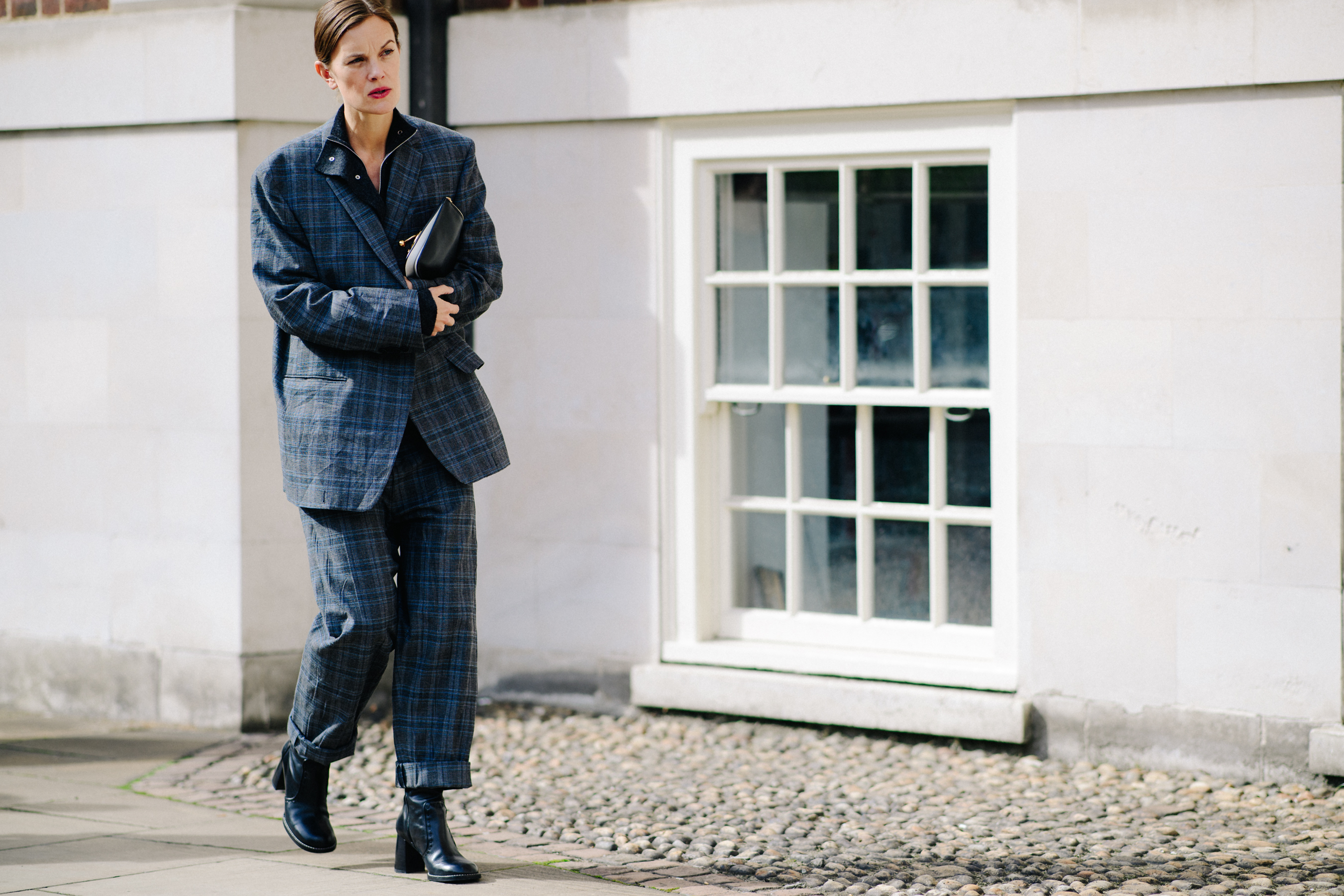 British fashion journalist wearing gray suit