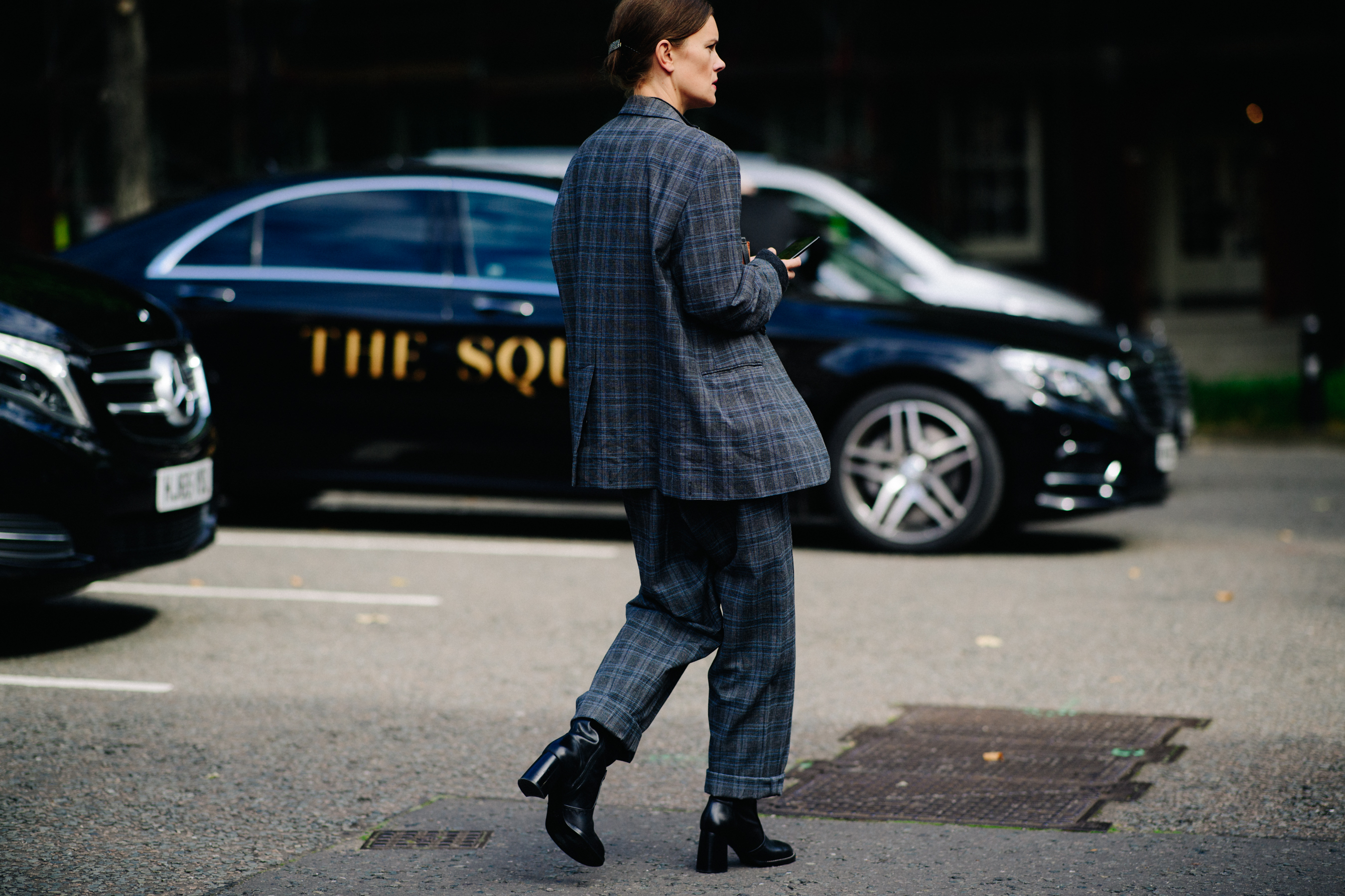 British fashion journalist wearing gray suit