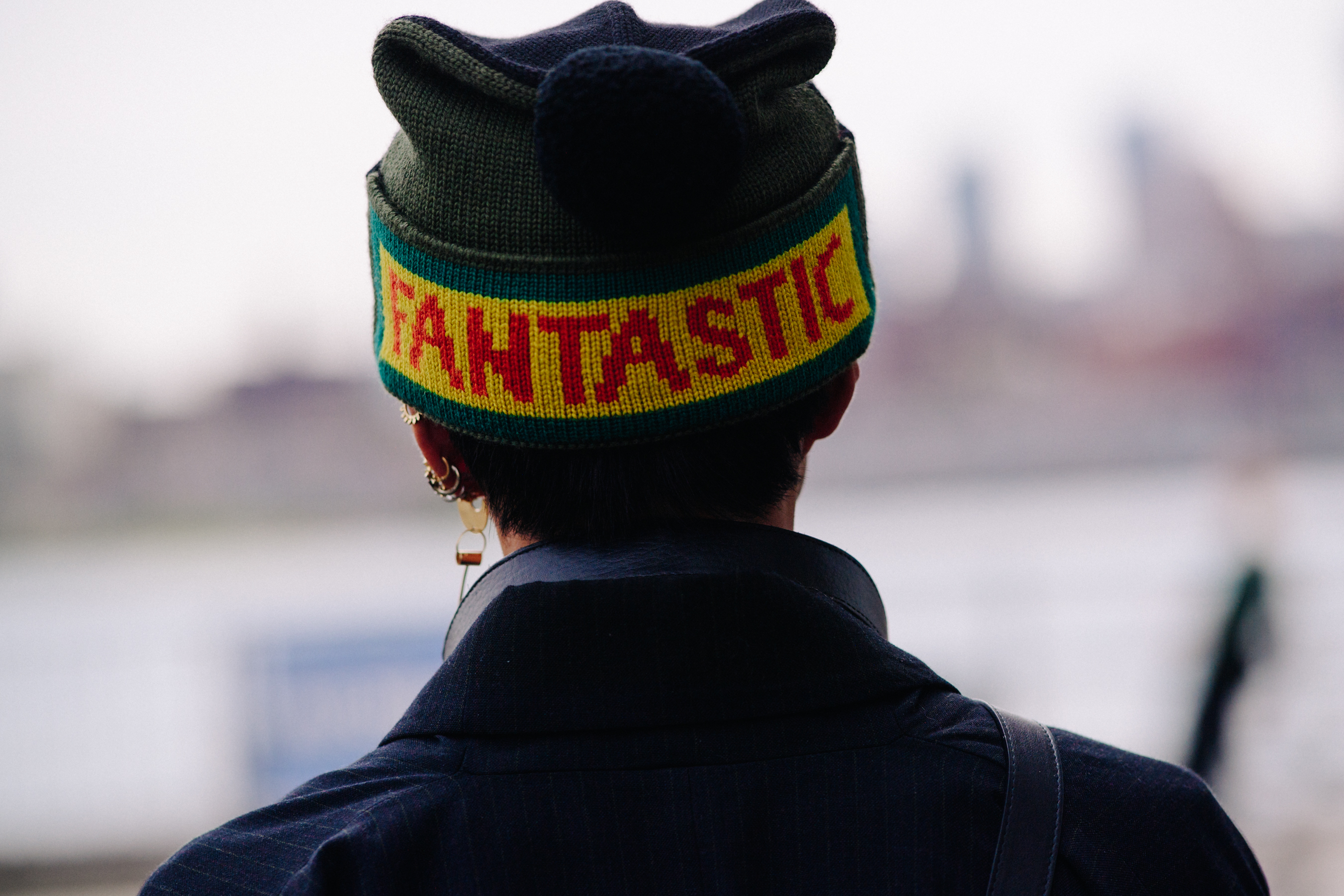 Person wearing suit and Fantastic beanie