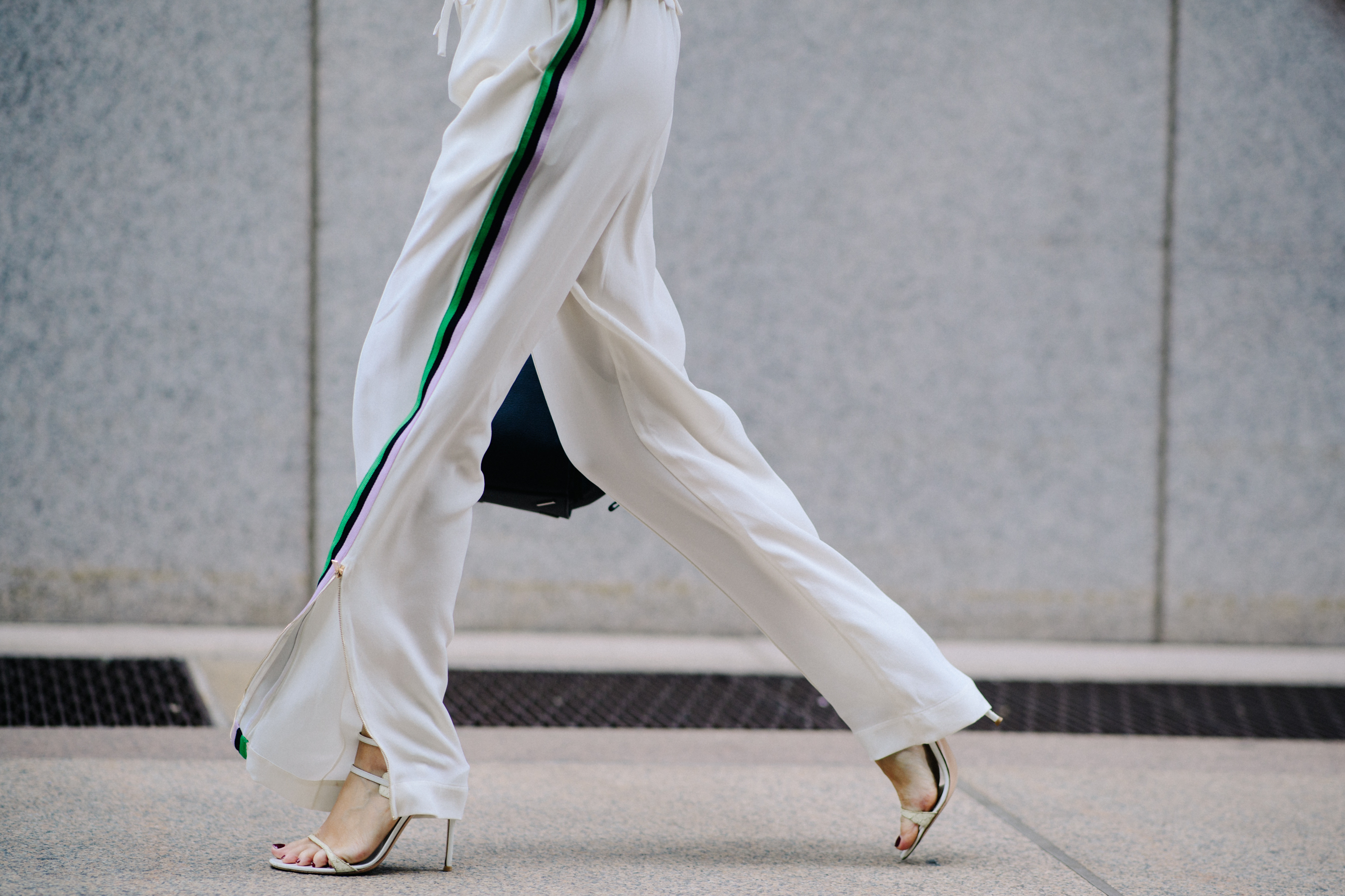 Woman wearing white silk jumpsuit