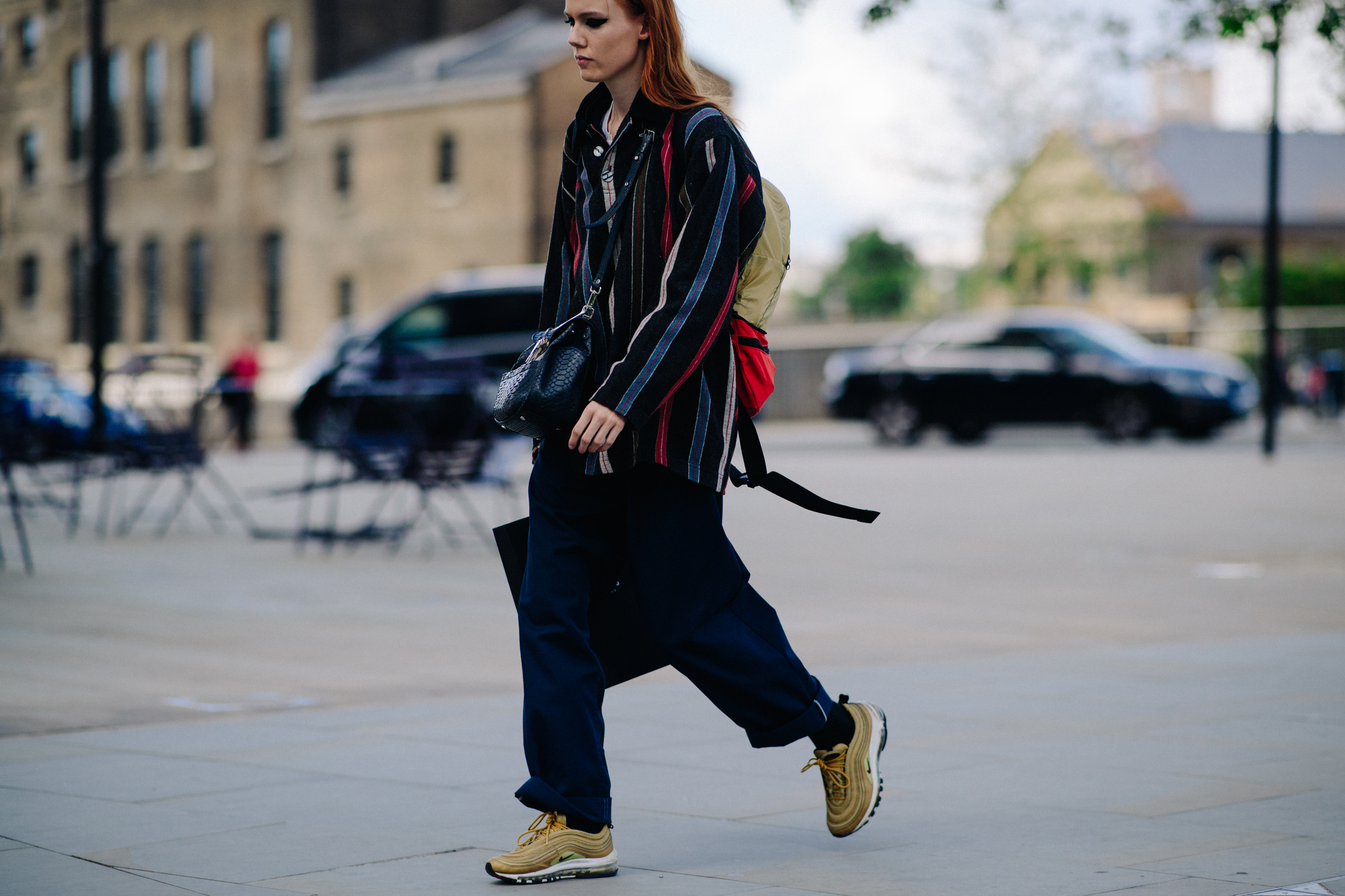 Model wearing Nike Air Max 97 sneakers