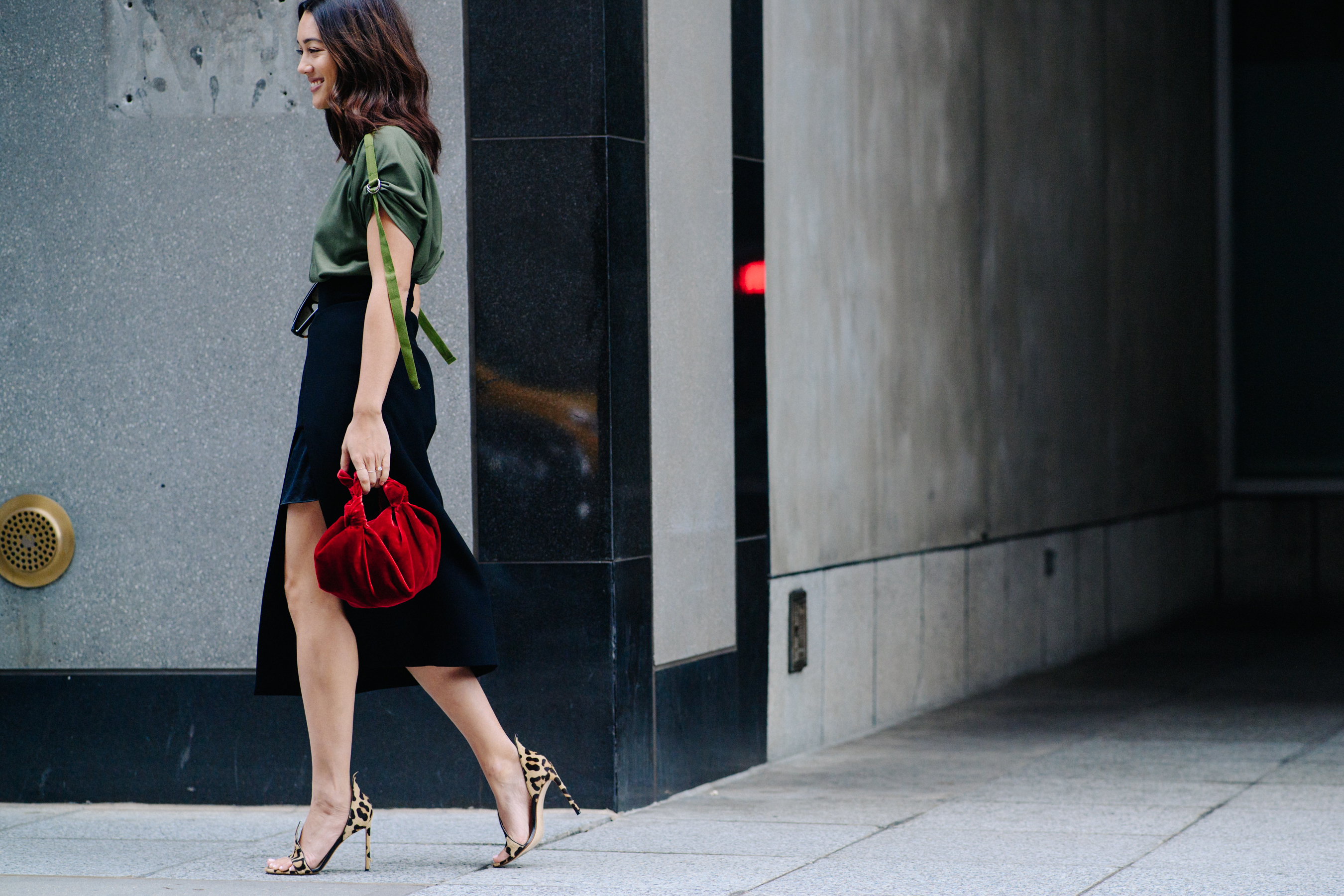 Girl wearing green top with skirt