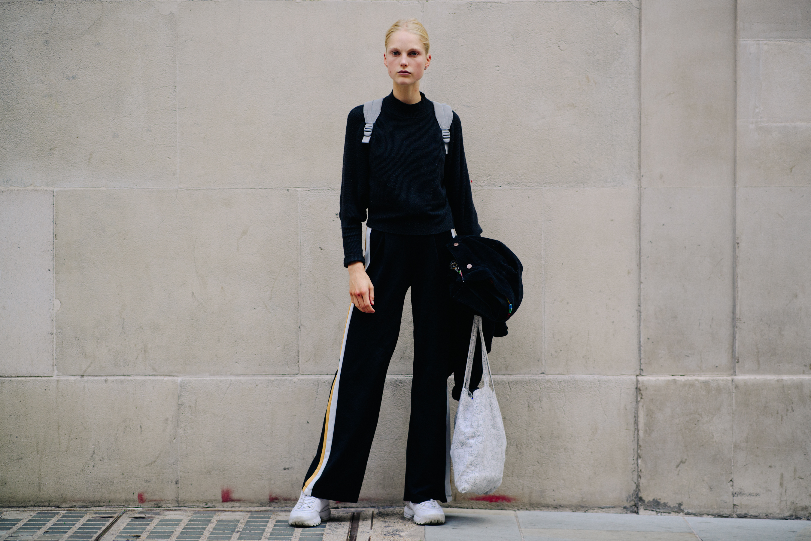 Model wearing all black after a show