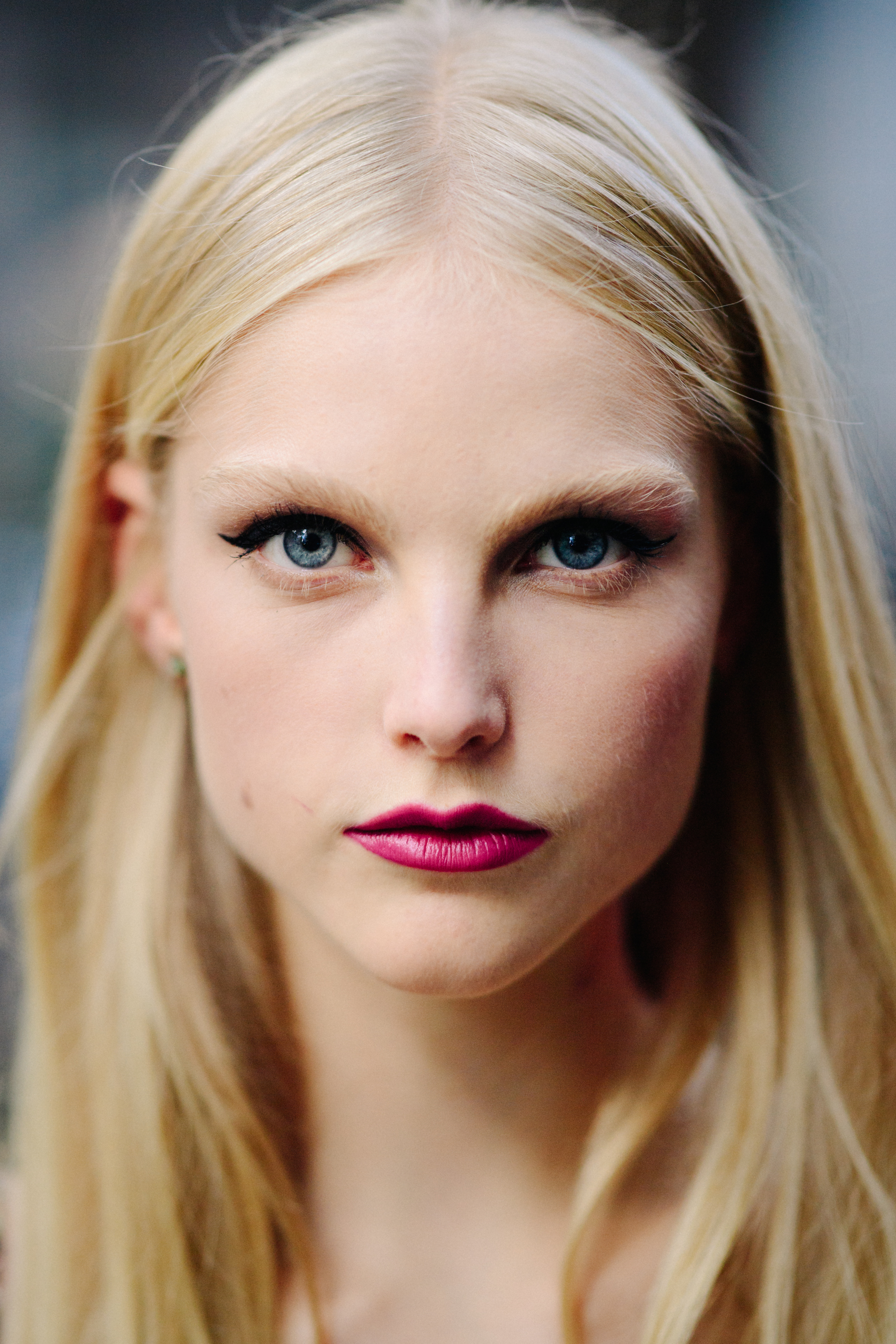 Portrait of a model with red lips after the show