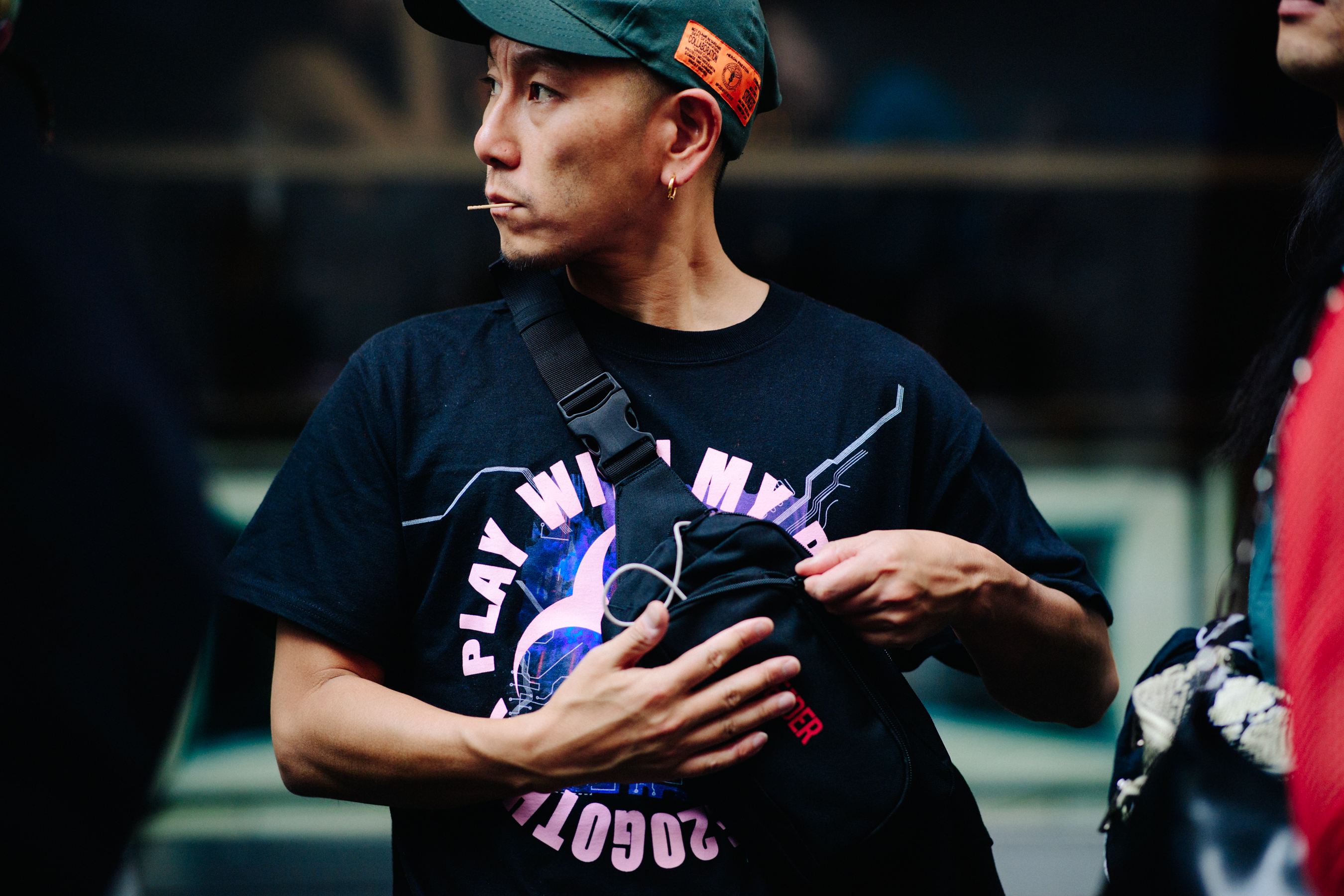 Man wearing Heron Preston hat
