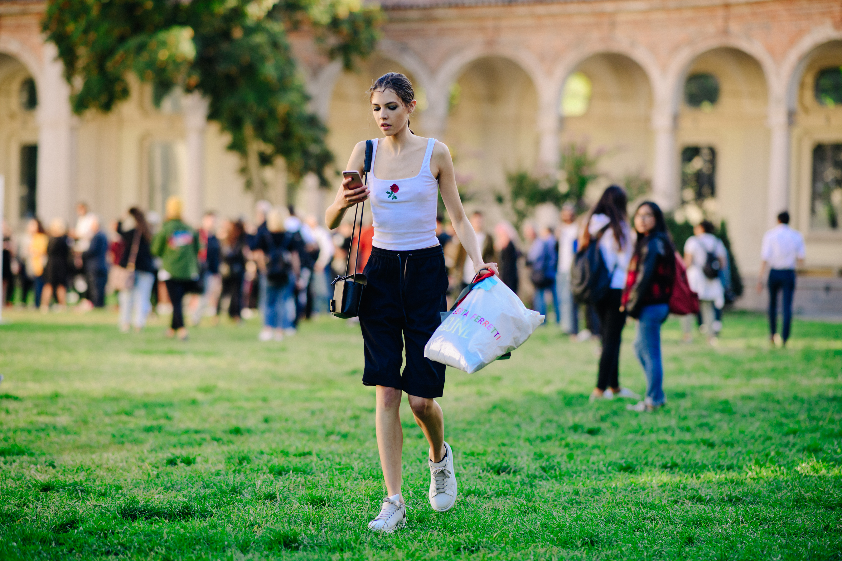 Model leaving show in floral vest