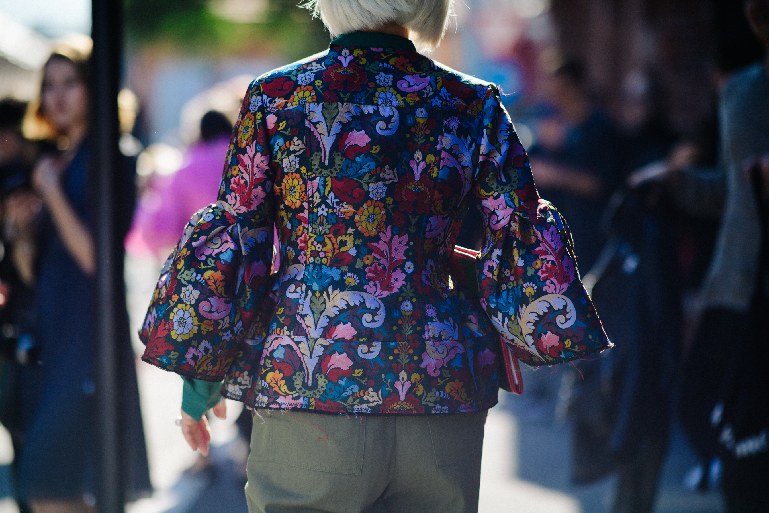 Back of woman wearing printed shirt