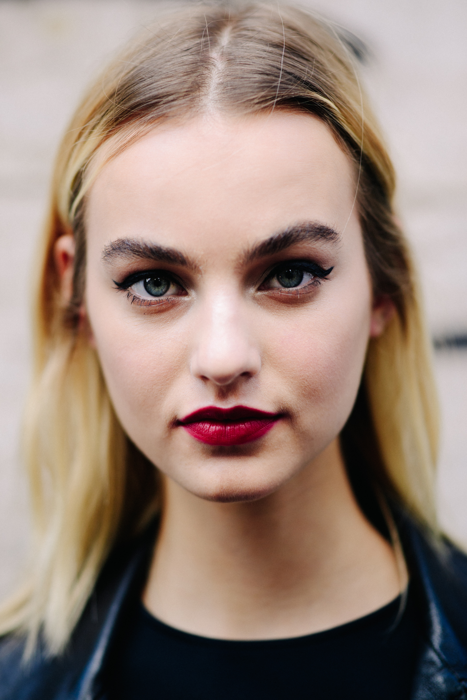 Portrait of a model with red lips after the show