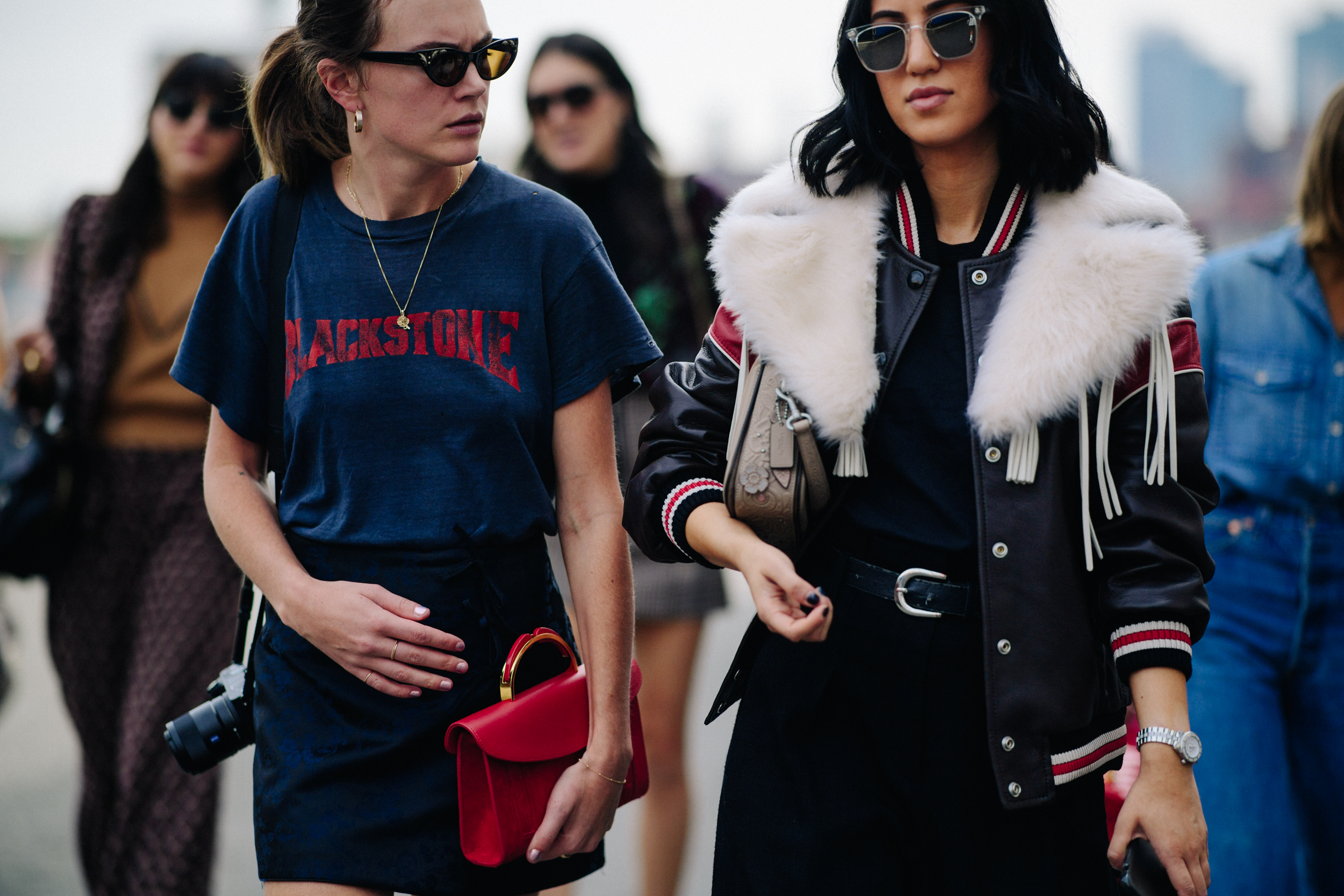 Two women wearing dark clothes