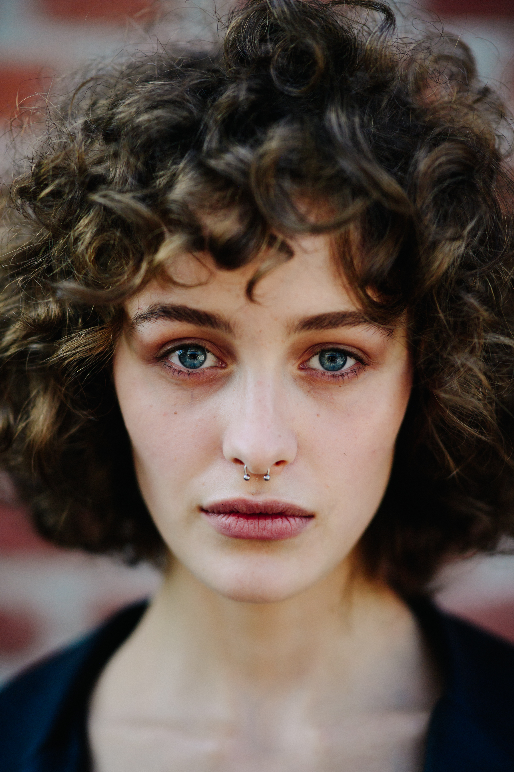 Portrait of model with blue eyes and curly hair
