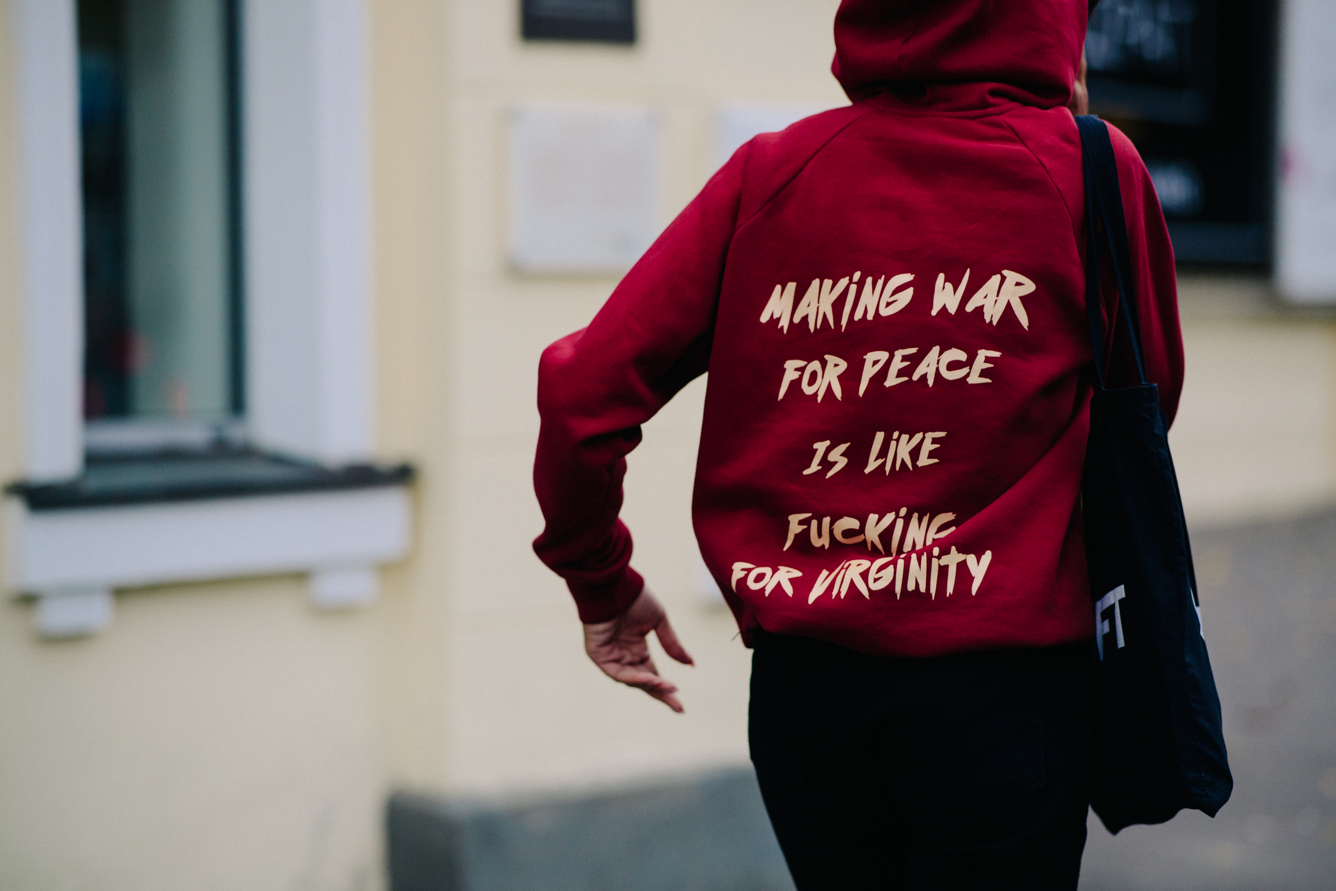 Girl wearing red statement hoodie