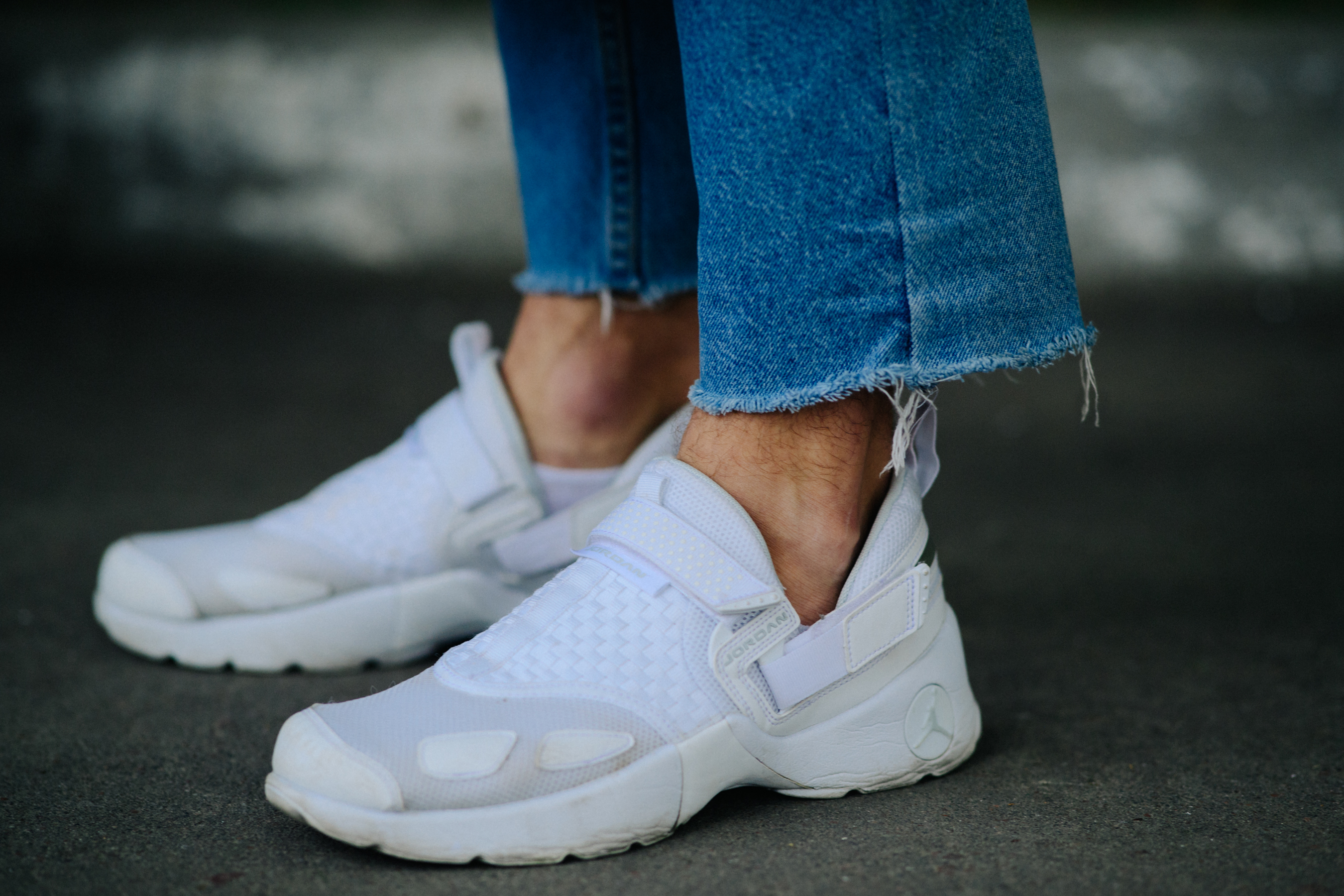 Man wearing cool white Jordan sneakers