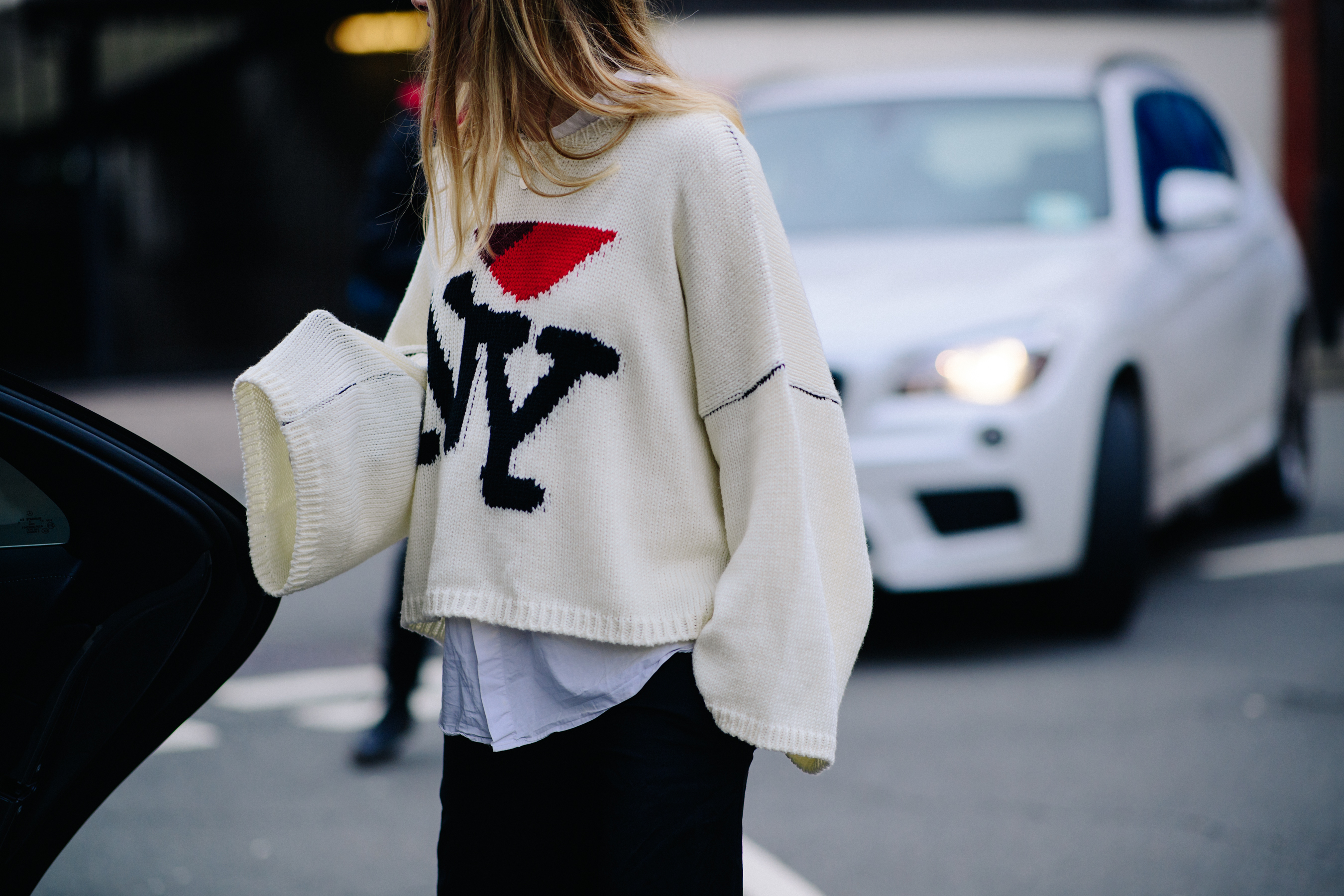 Woman wearing oversized Raf Simons sweater
