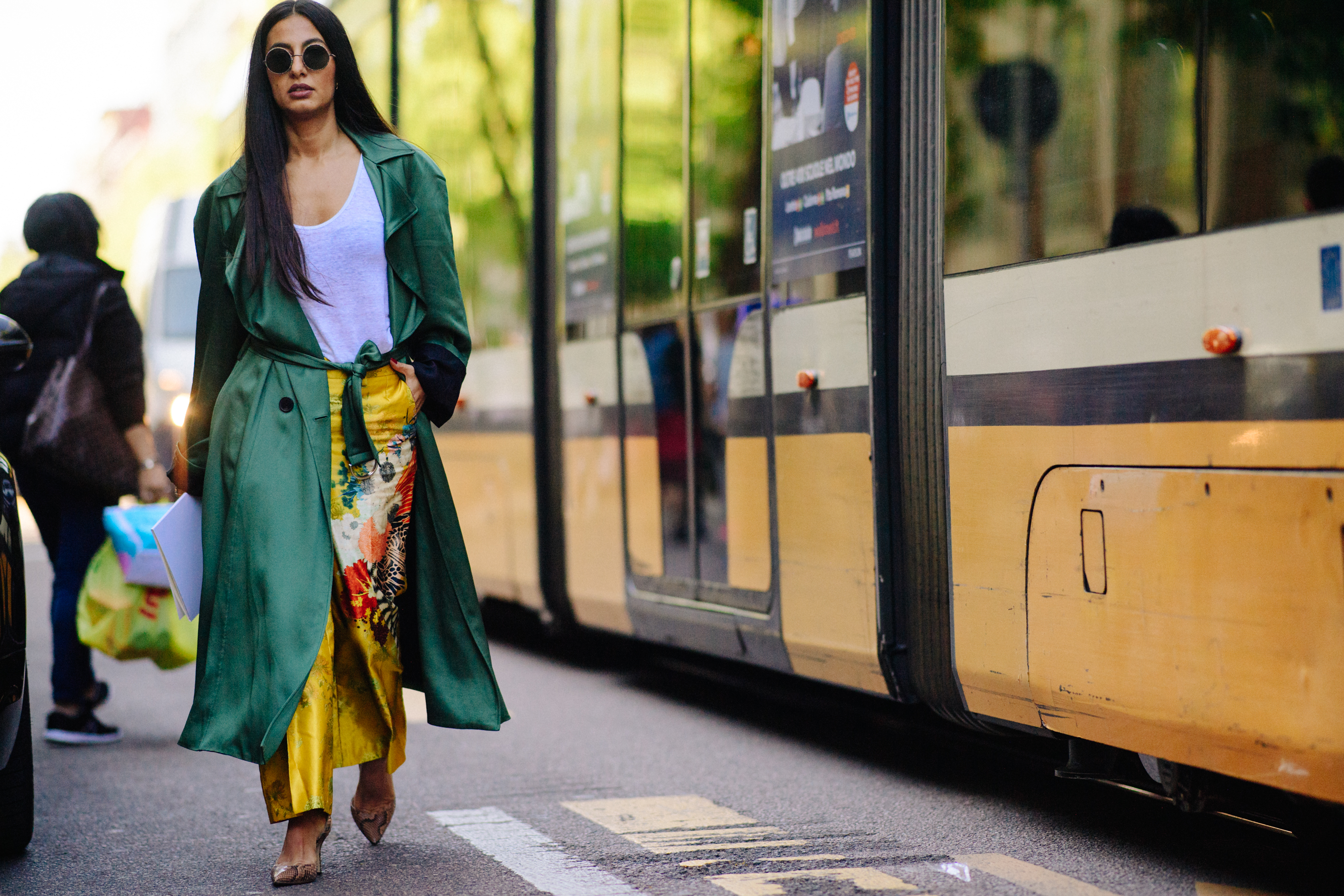 Blogger walking by tram