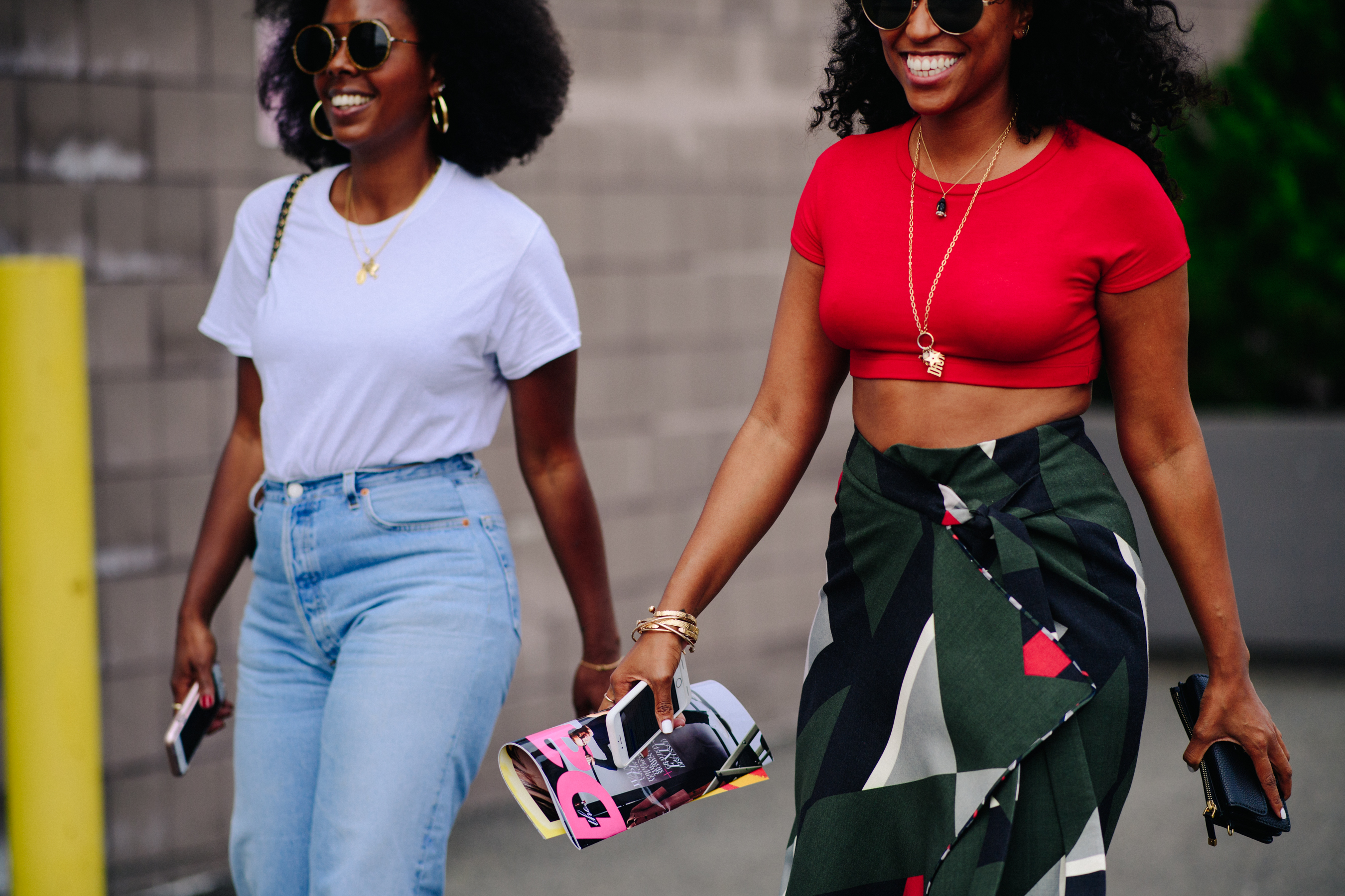 Two stylists wearing t-shirts