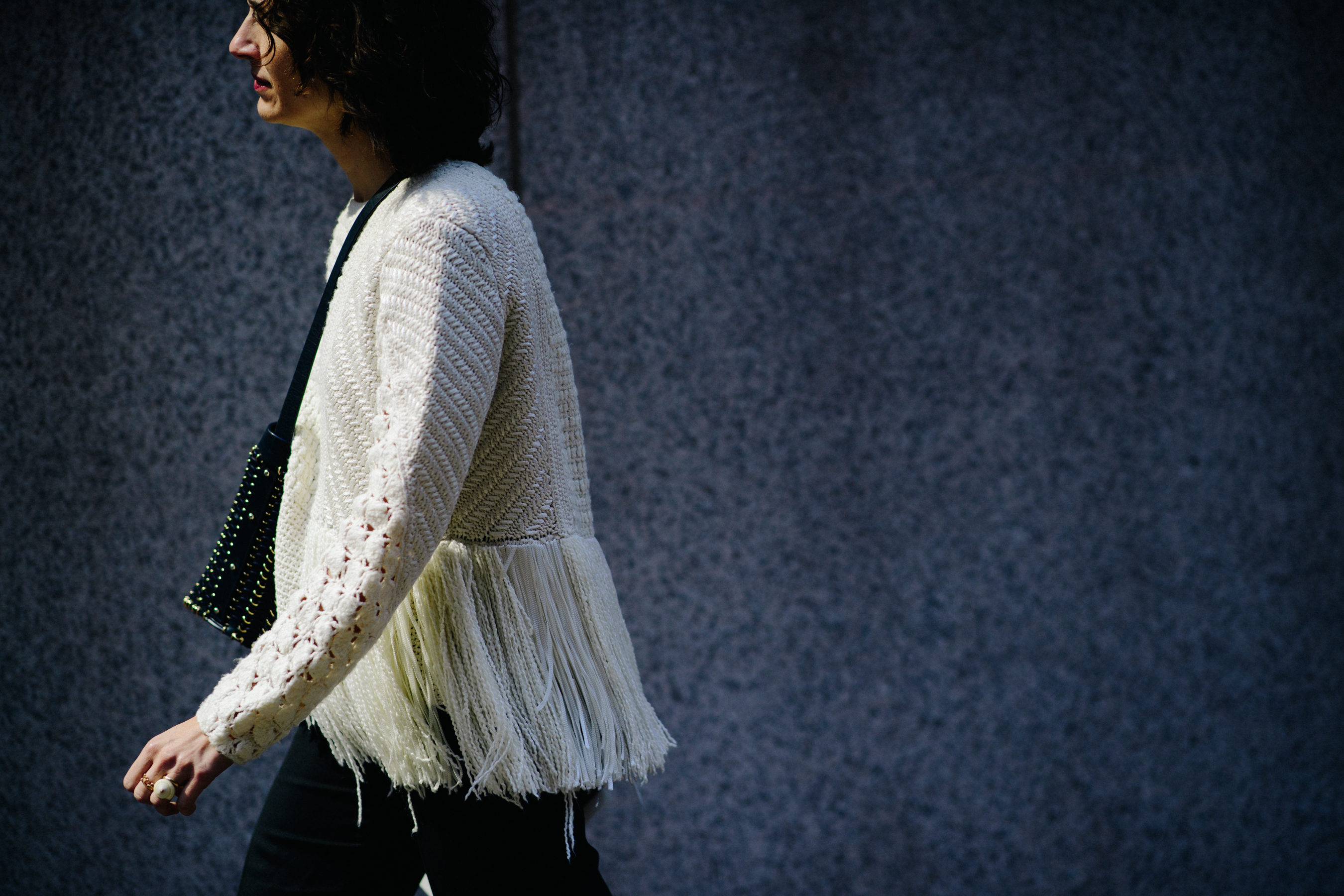 Woman wearing white top and black trousers