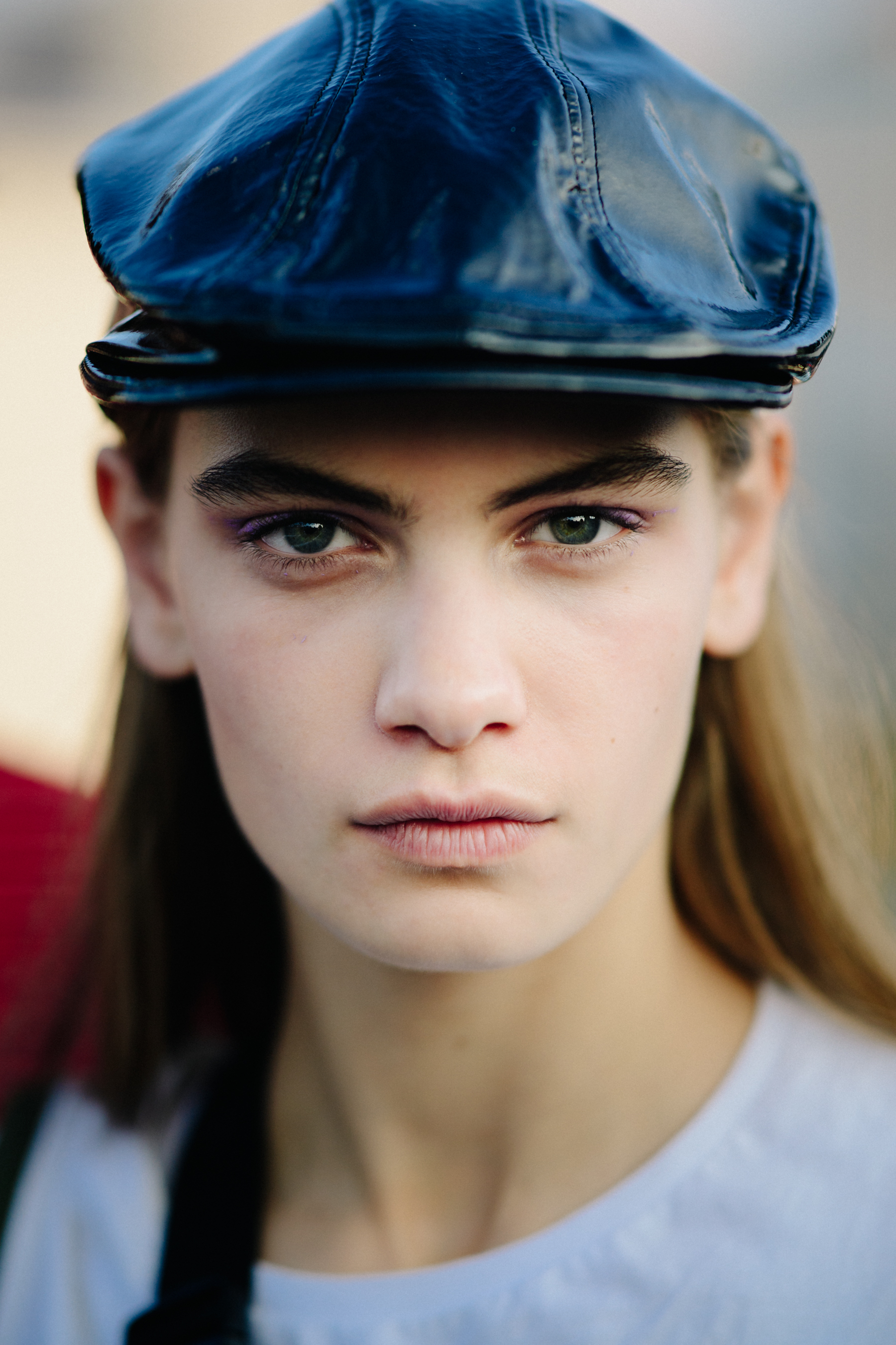 Portrait of Danish model wearing black leather cap