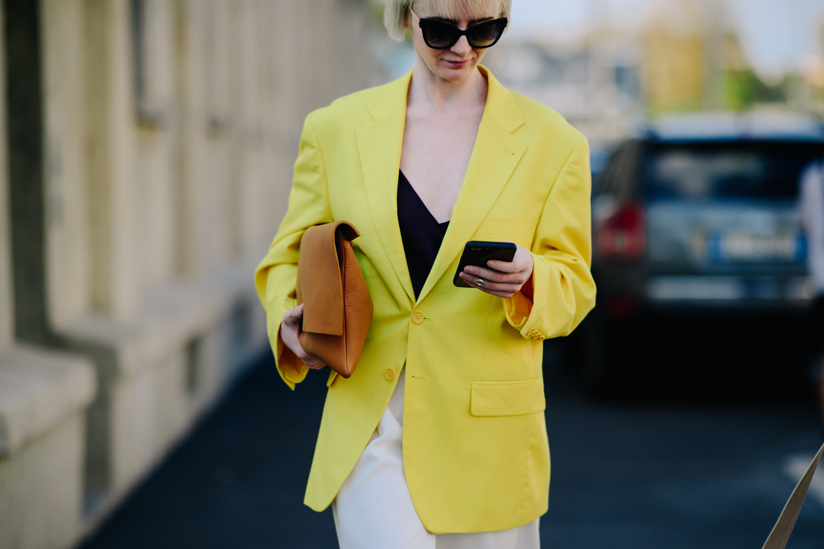 Woman on phone wearing yellow jacket