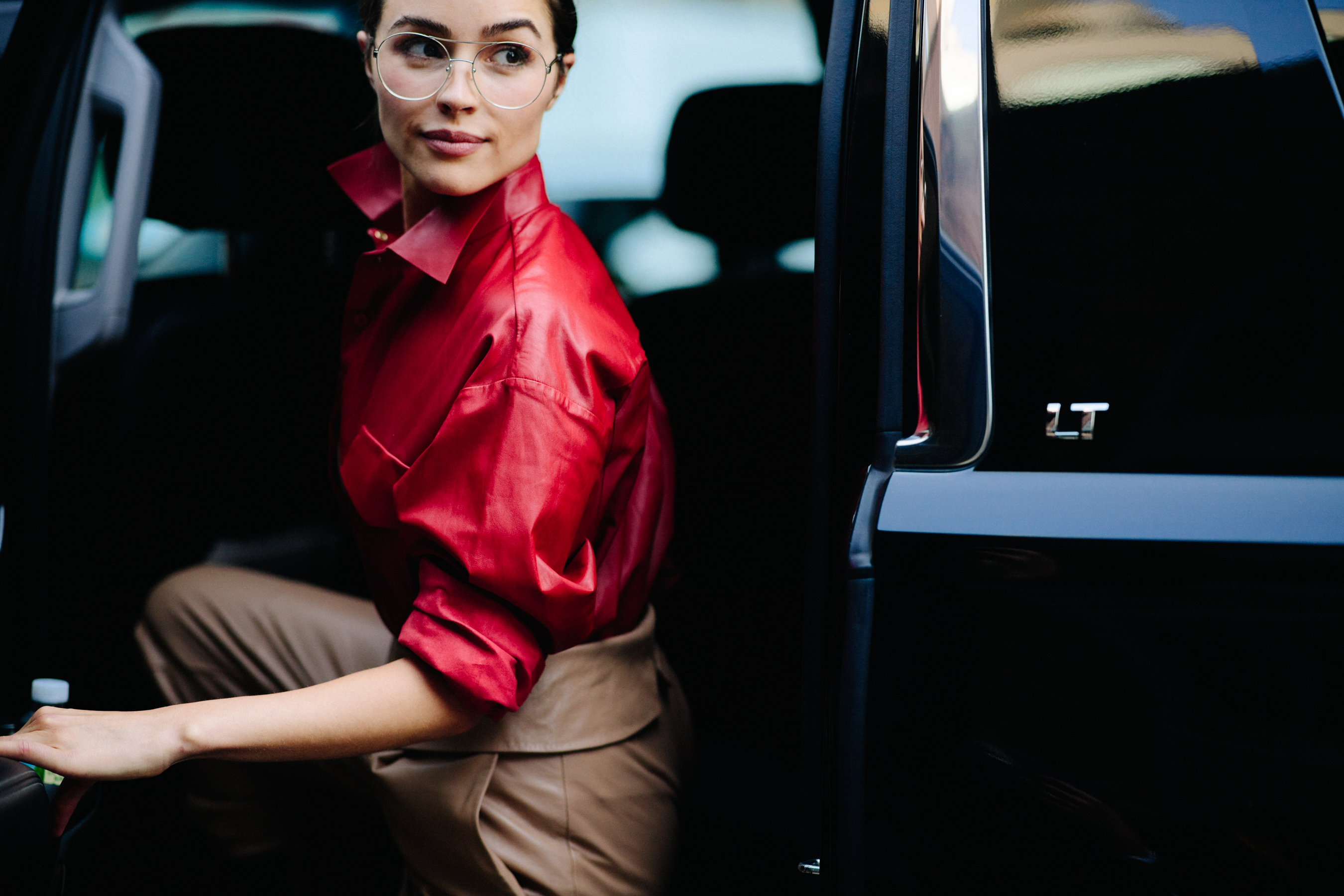 Woman wearing red leather top