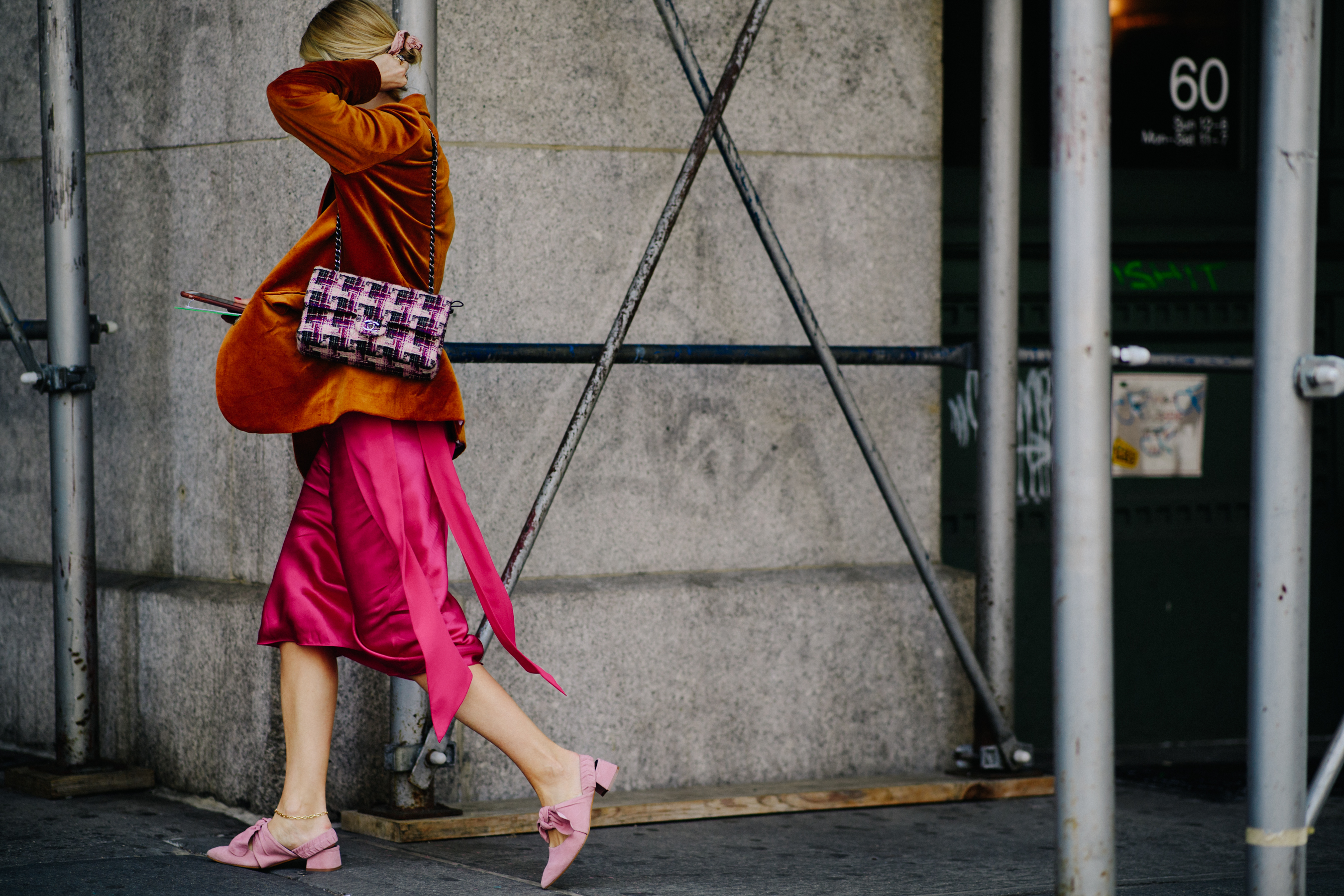 Woman wearing pink and orange