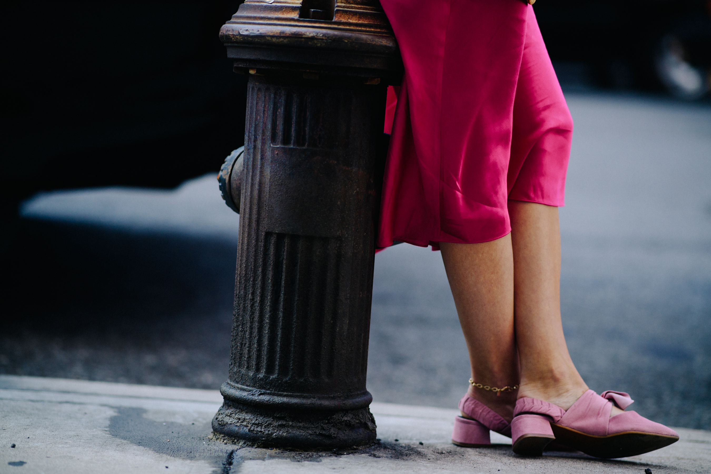Woman wearing pink shoes and dress