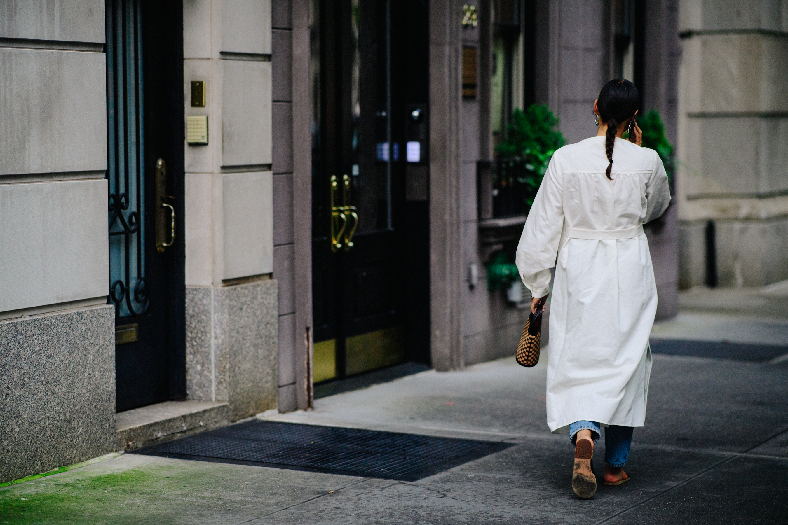 Editor wearing long white dress