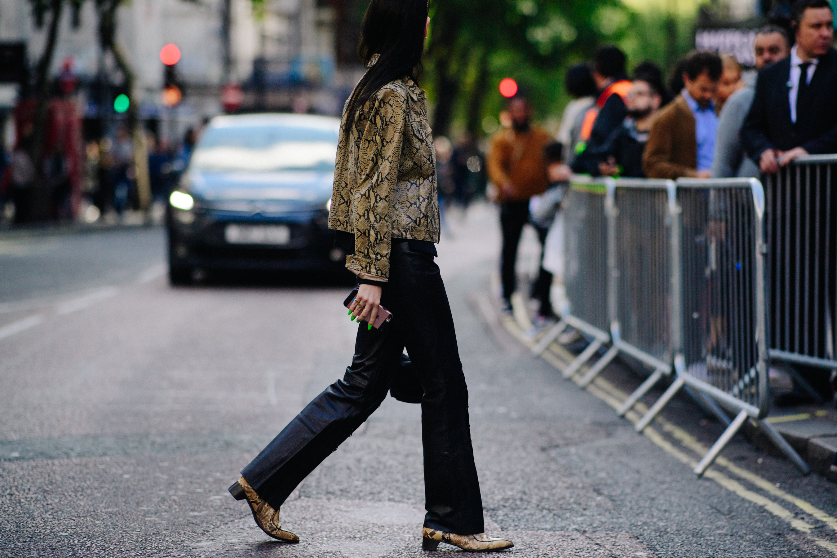 Editor wearing snakeskin jacket and boots