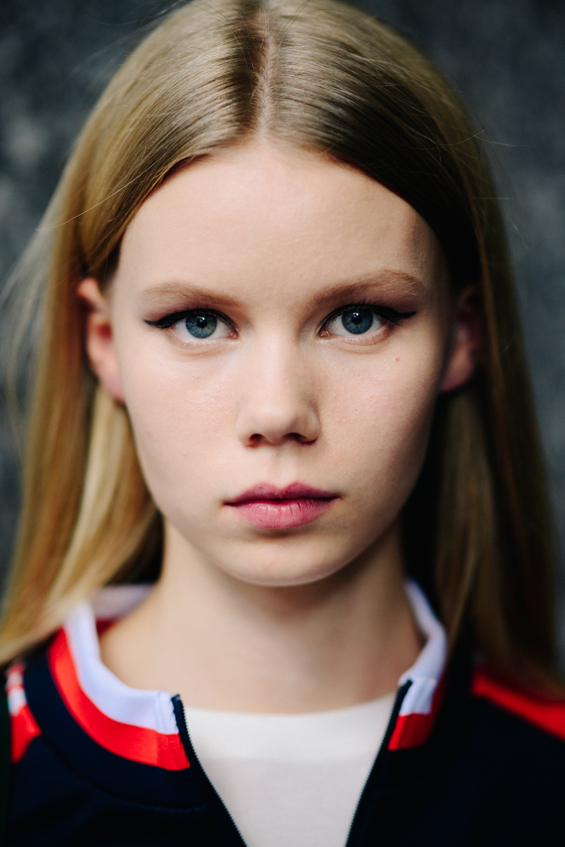 Portrait of a model with red lips after the show