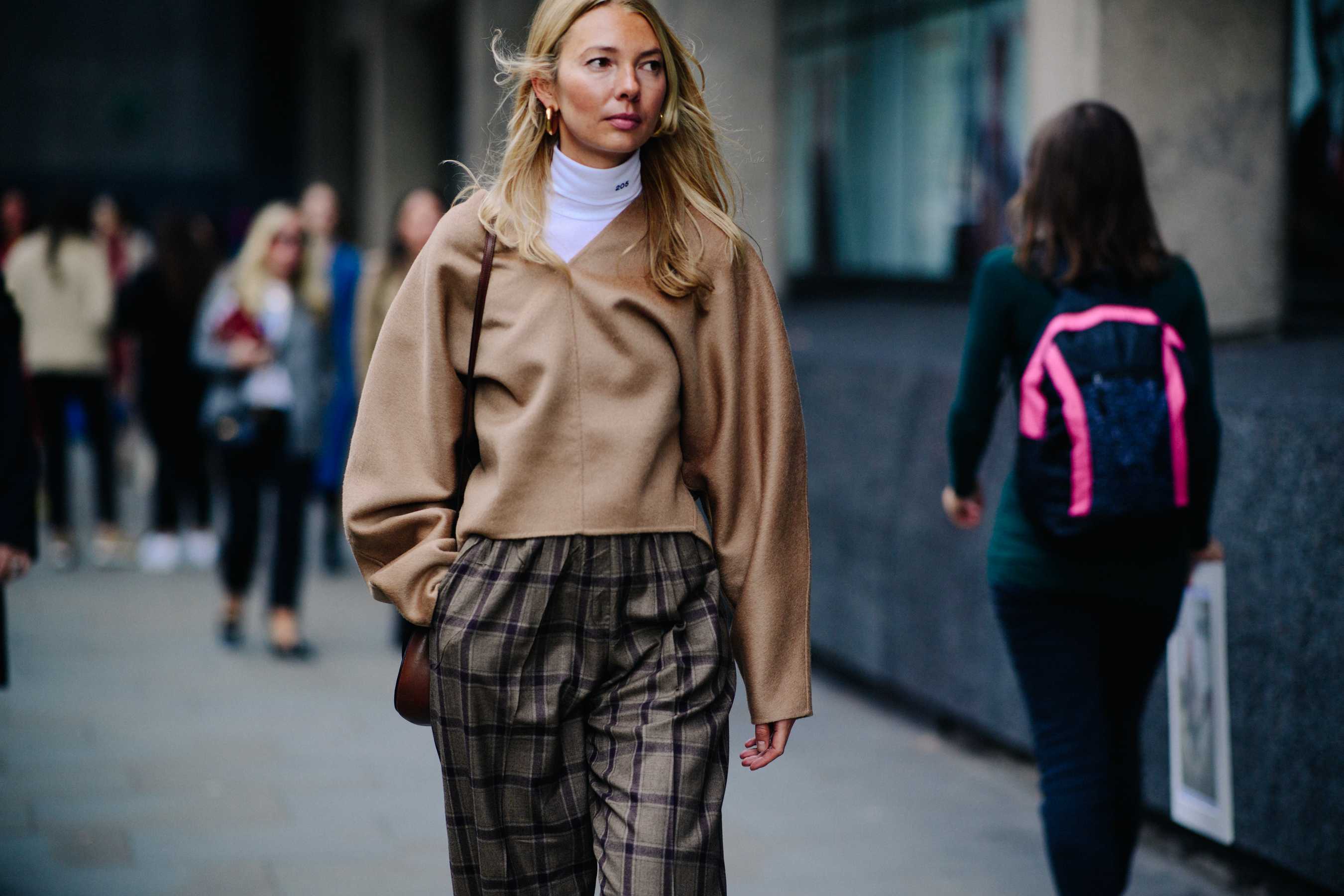 Buyer wearing beige outfit