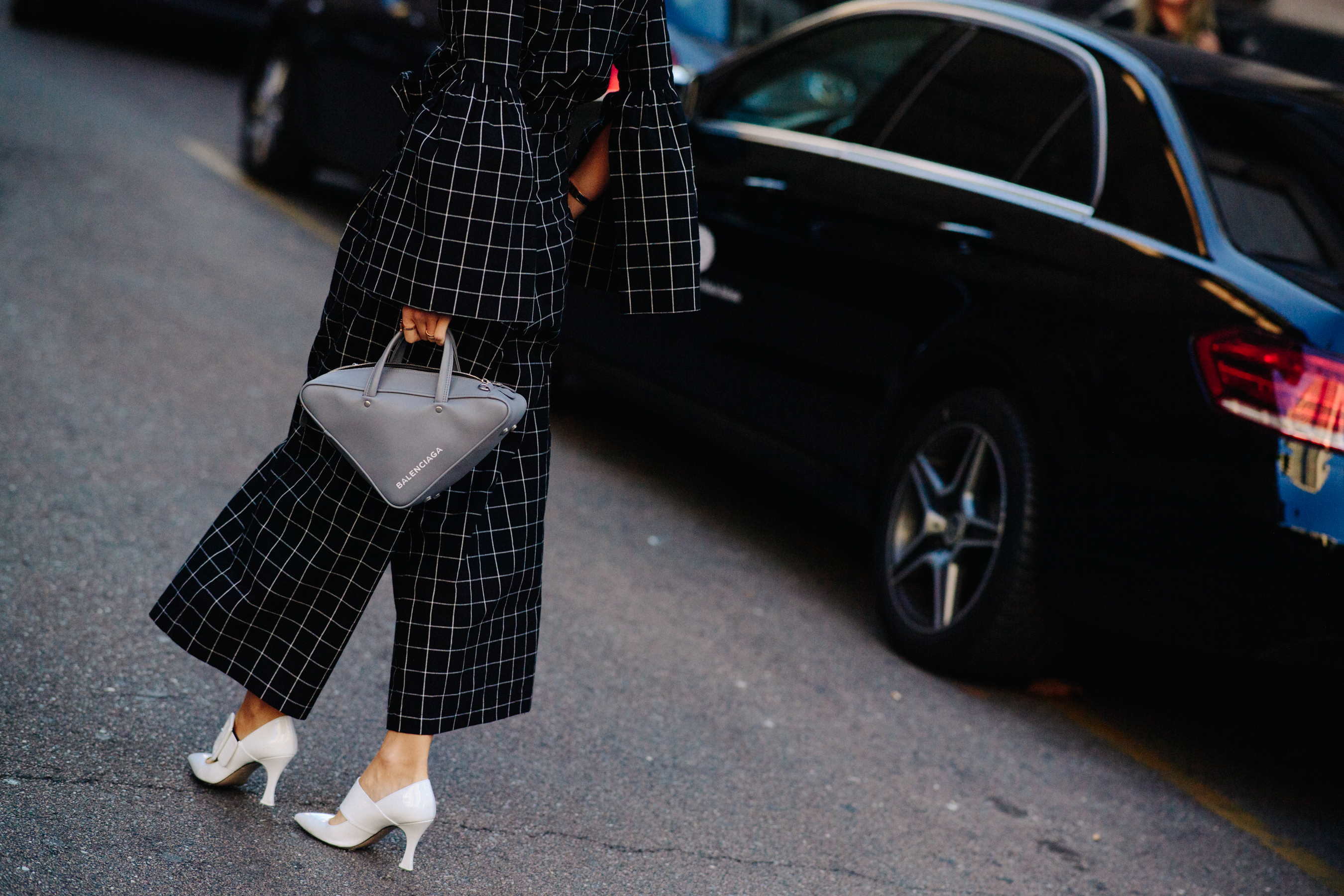 Closeup of woman with triangular bag