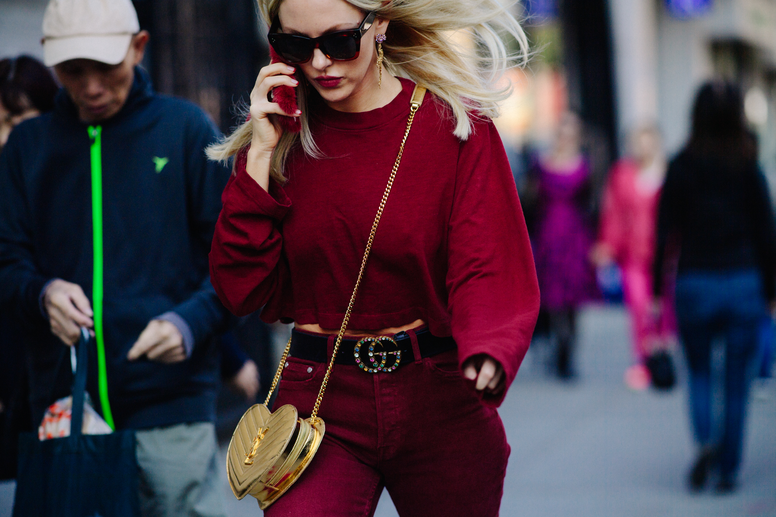 Woman wearing Gucci belt and red outfit