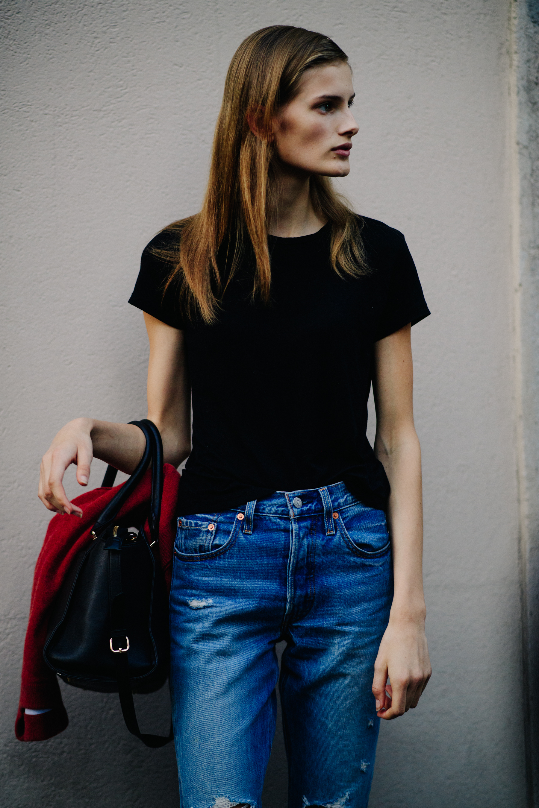 Norwegian model in denim jeans and black tee shirt