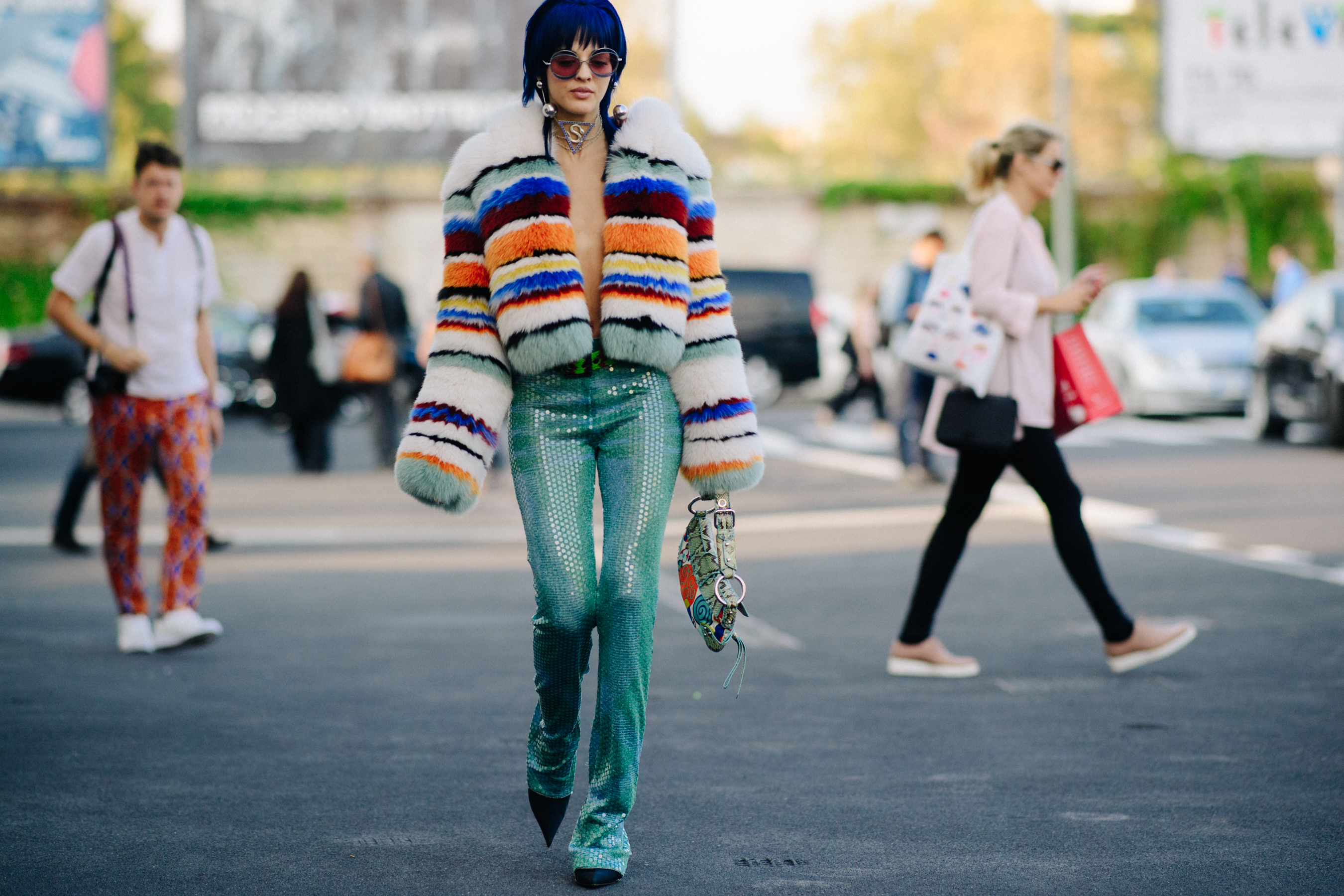 Woman walking in coloured fur jacket