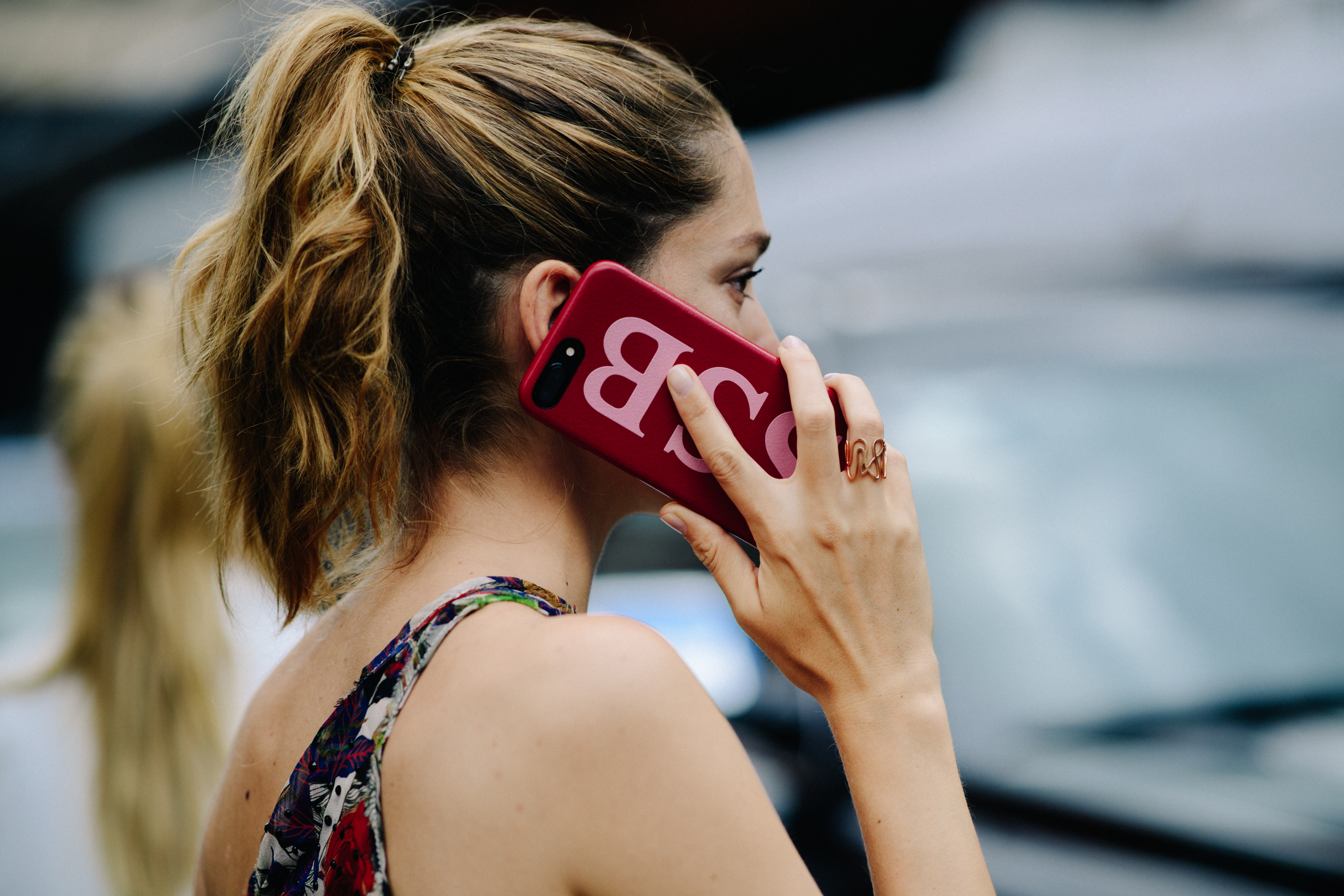 Blogger holding red phone case