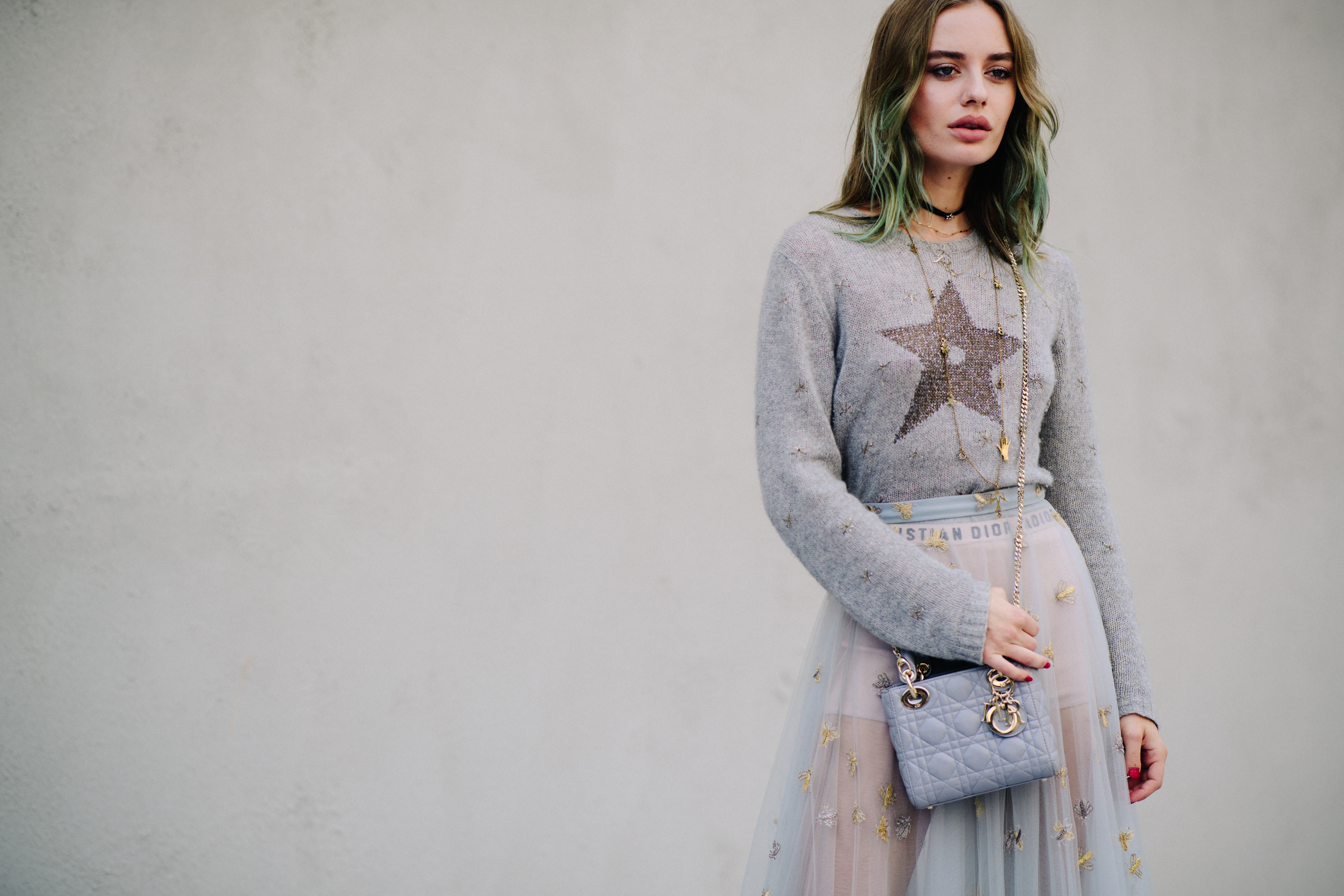 Woman wearing long sheer Dior skirt