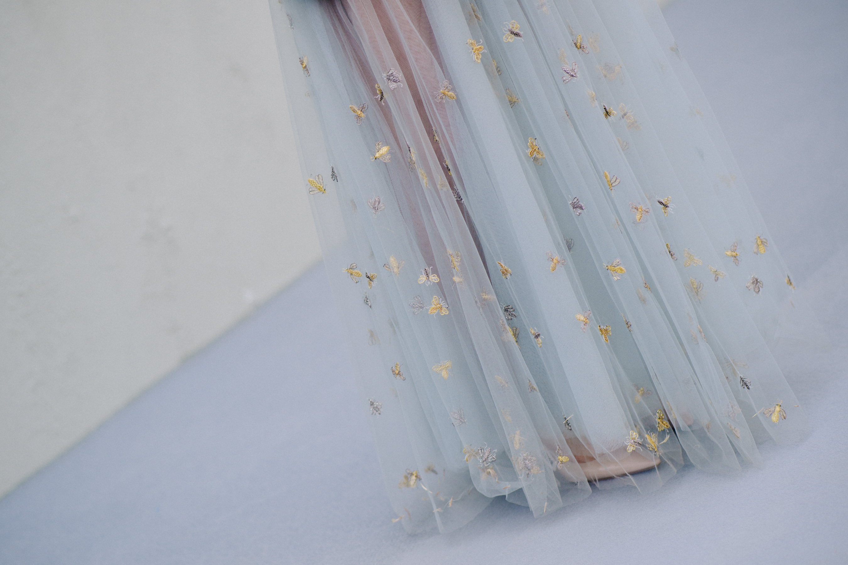 Woman wearing long sheer Dior skirt