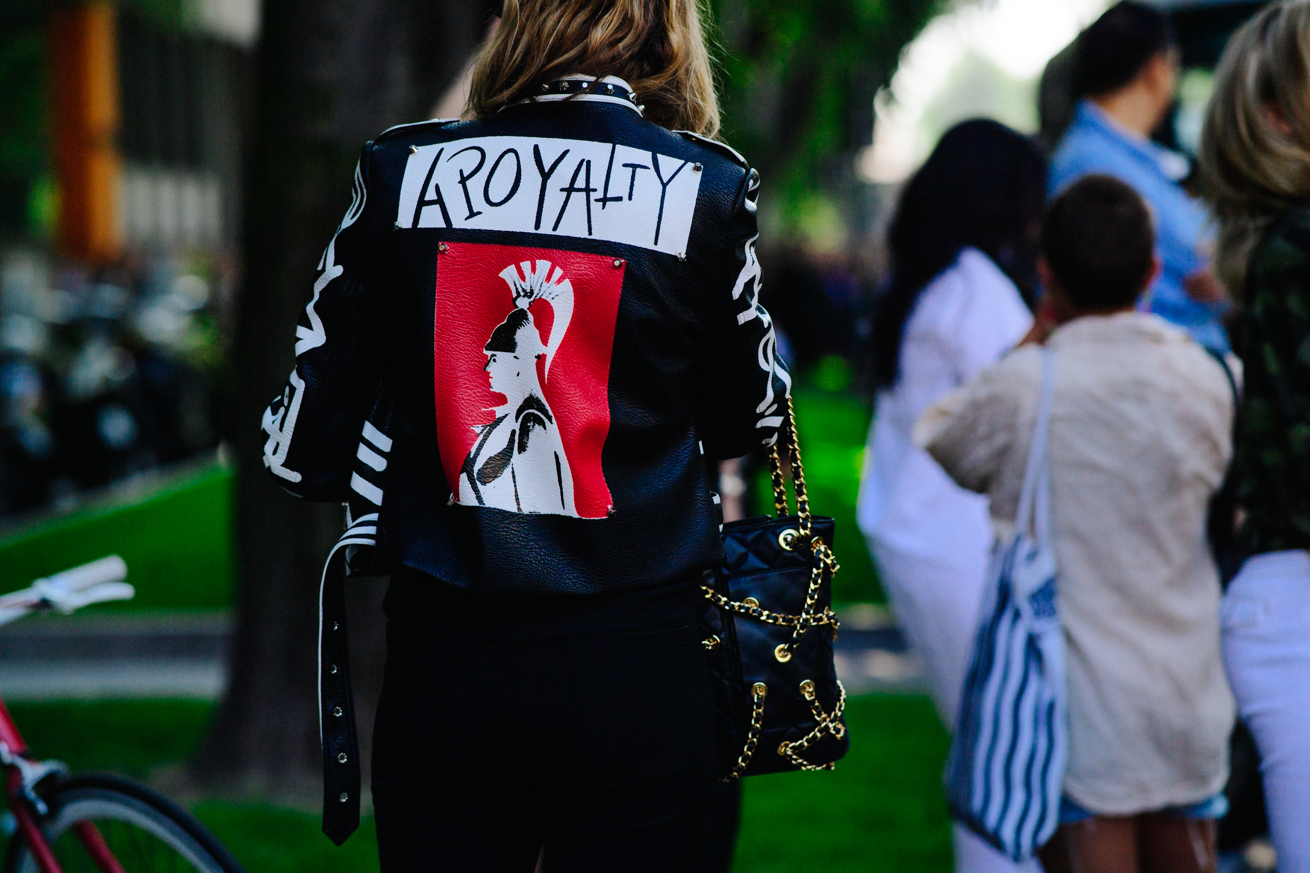Woman wearing back graphic leather jacket