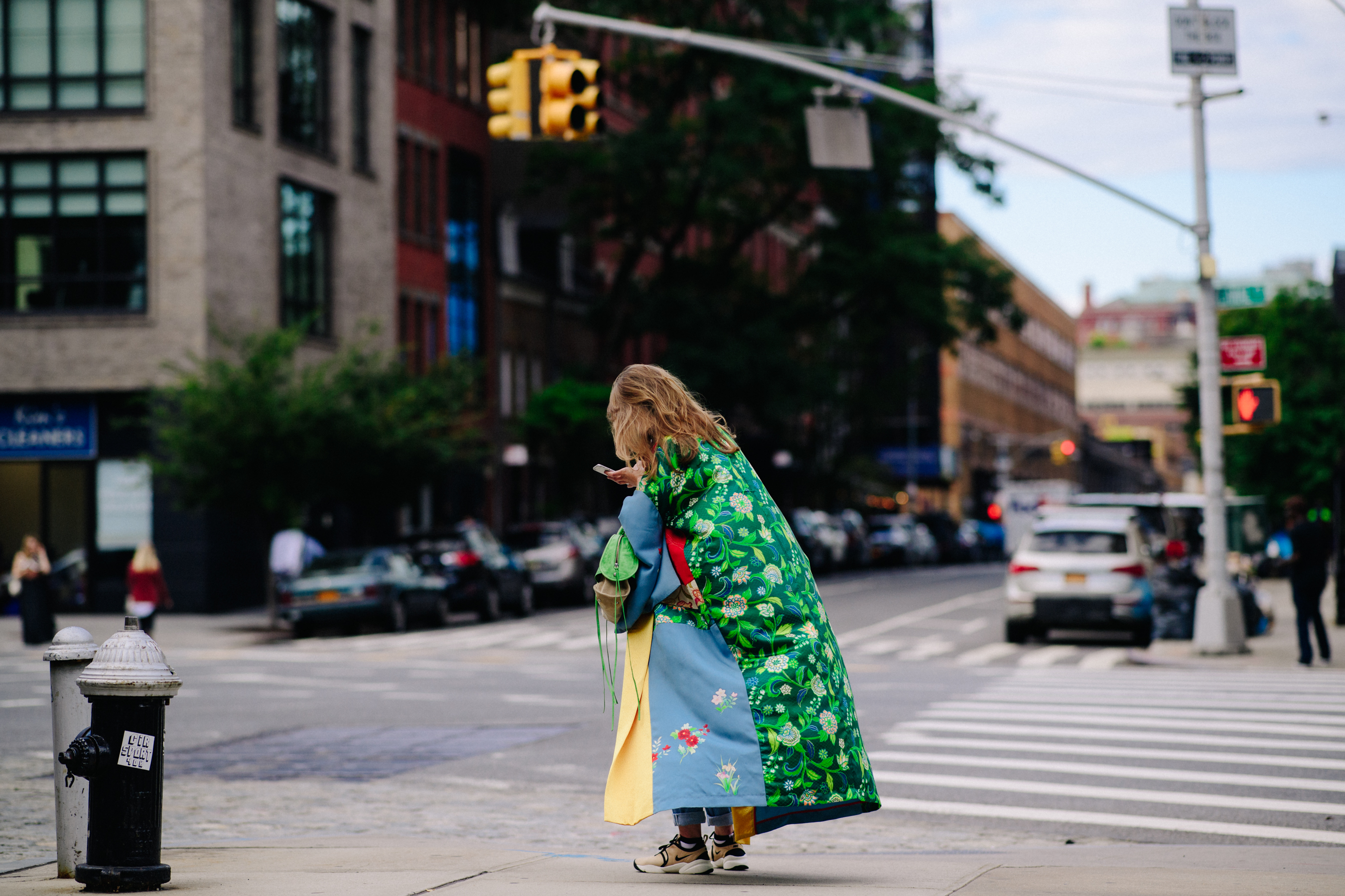 Woman wearing long colourful coat