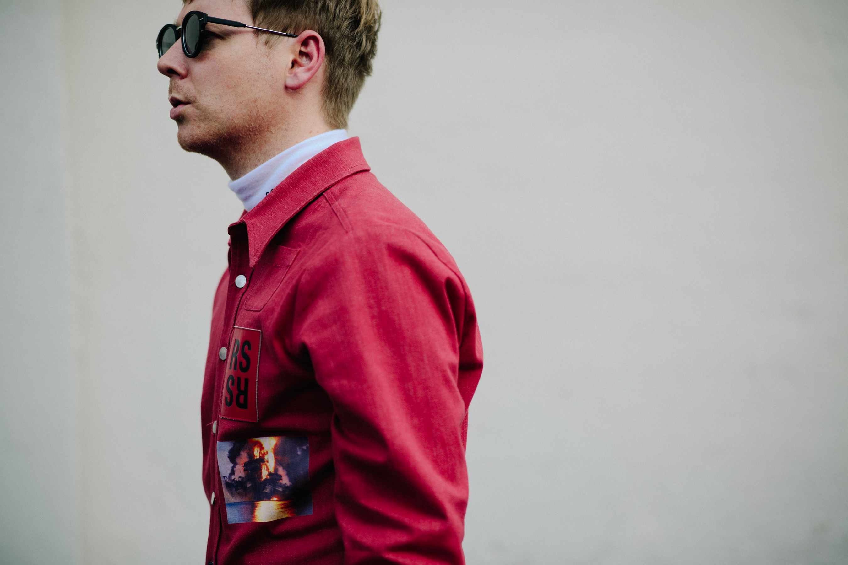 Man wearing red Raf Simons denim jacket