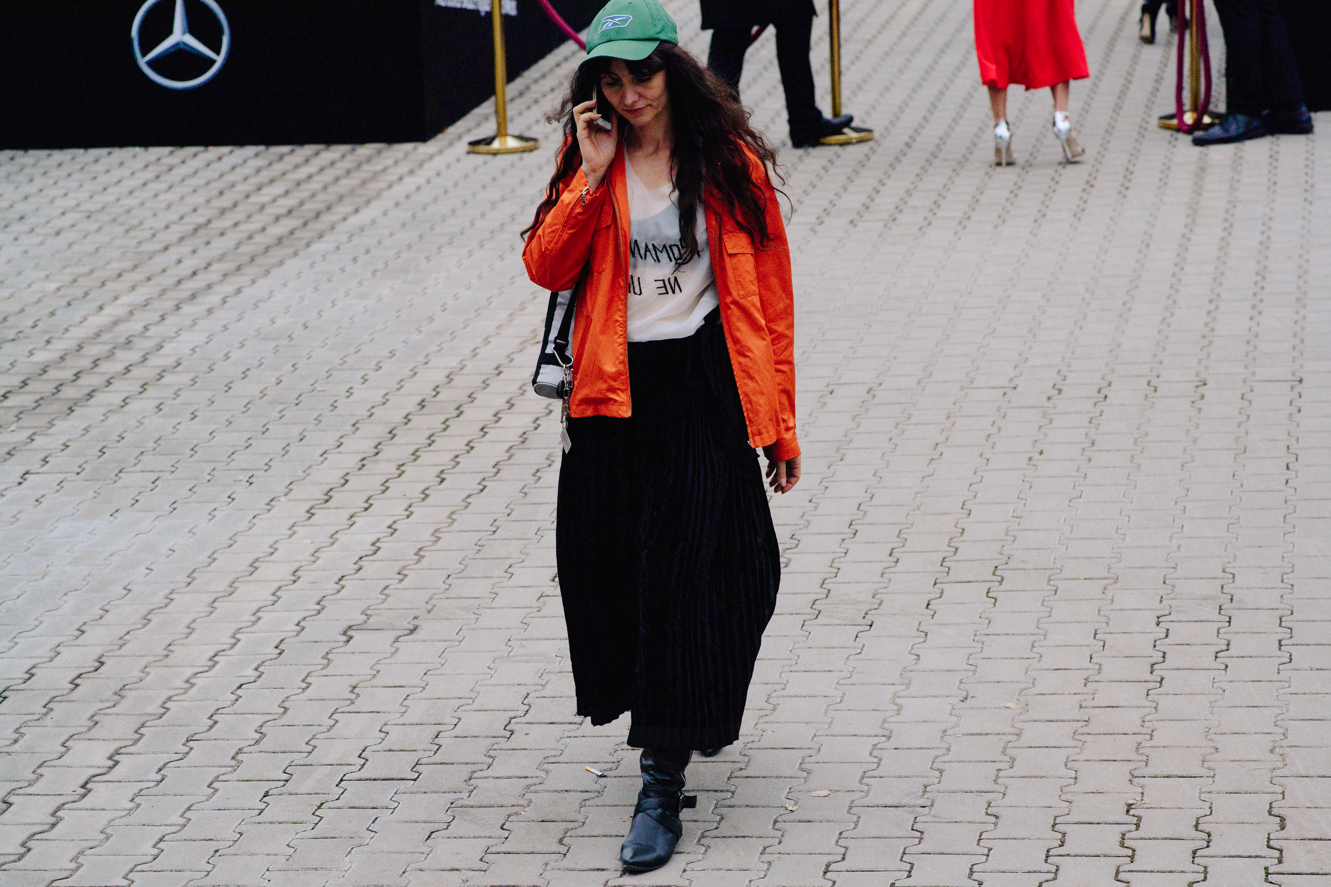Woman wearing orange jacket
